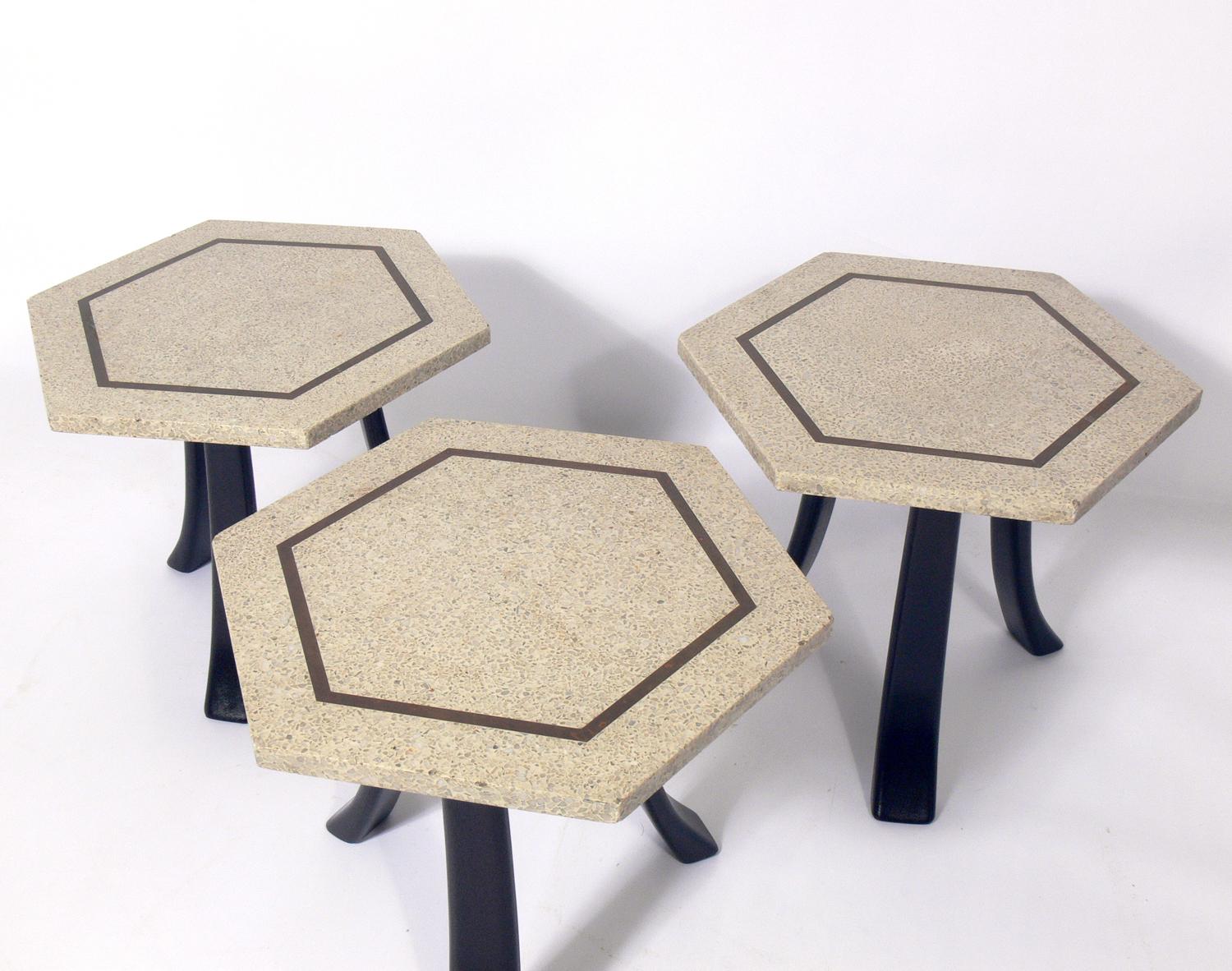 Selection of Harvey Probber hex tables, American, circa 1960s. The wood bases have been refinished in an ultra-deep brown. The tops are constructed of terrazzo inlaid with brass and retain their warm original patina. They are priced at $1500 each,