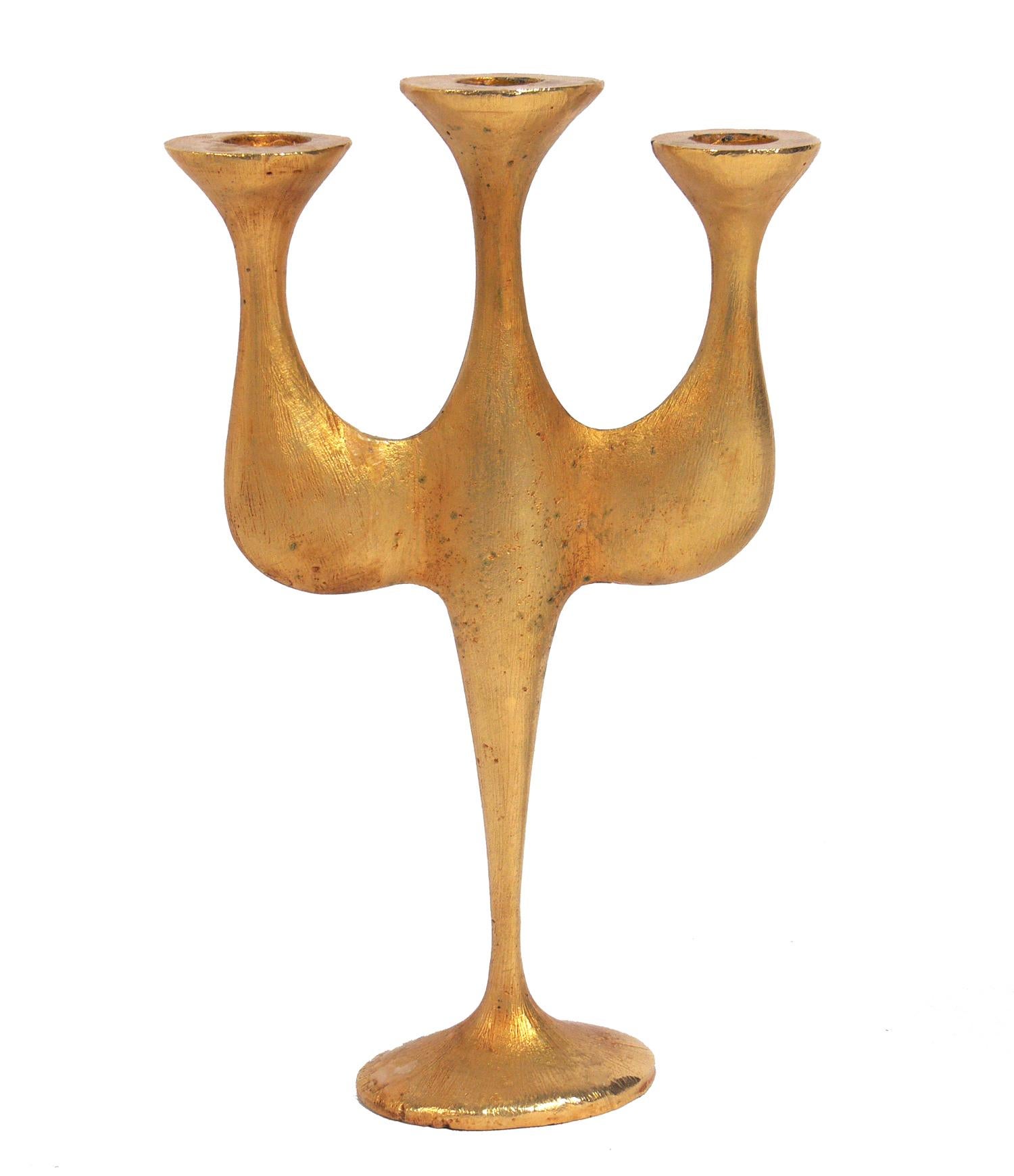 Selection of modernist candelabra or candlesticks. From left to right, they are:
1) Sculptural gilt bronze candelabra by Nicolas de Wael for Fondica, France, circa 1995. It measures: 10.75