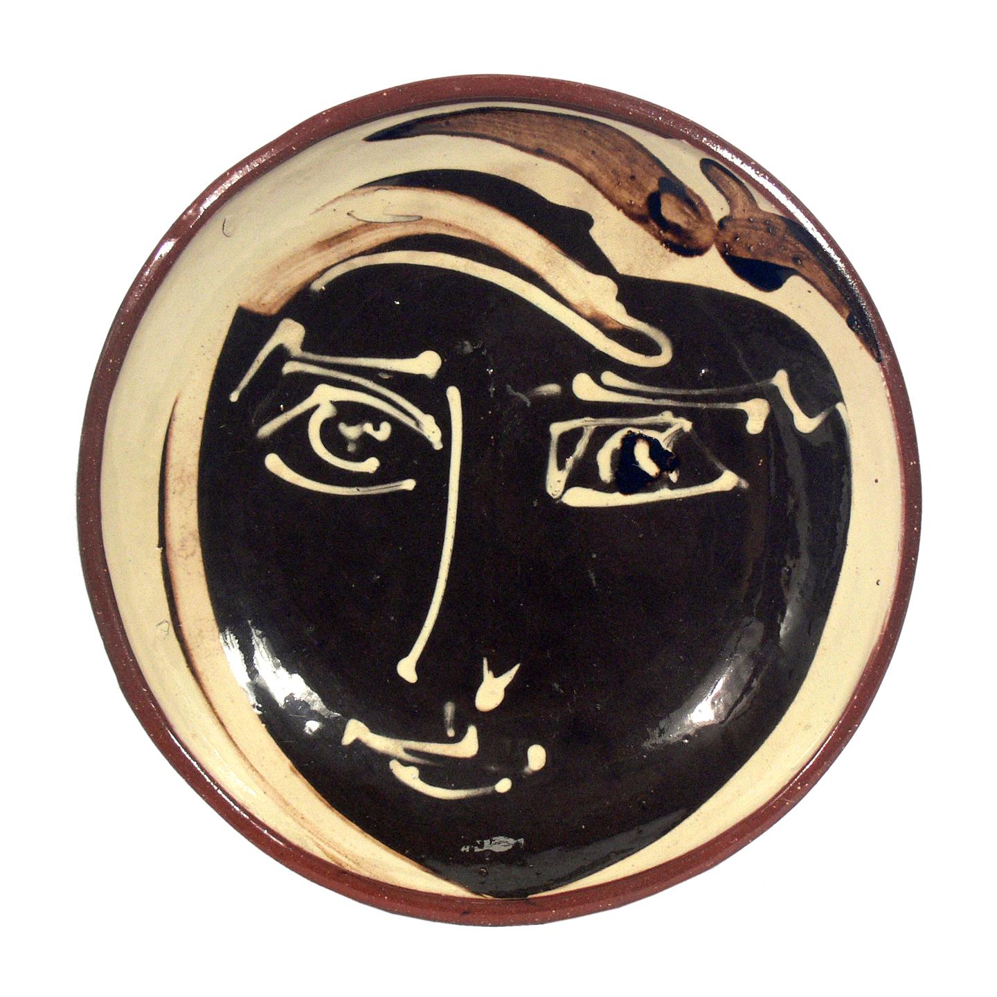 Selection of modernist ceramic plaques, circa 1950s. They are:
1) Mischievous boy ceramic plaque, in the manner of Pablo Picasso, French, circa 1950s. It is pictured at the top and measures 12.5