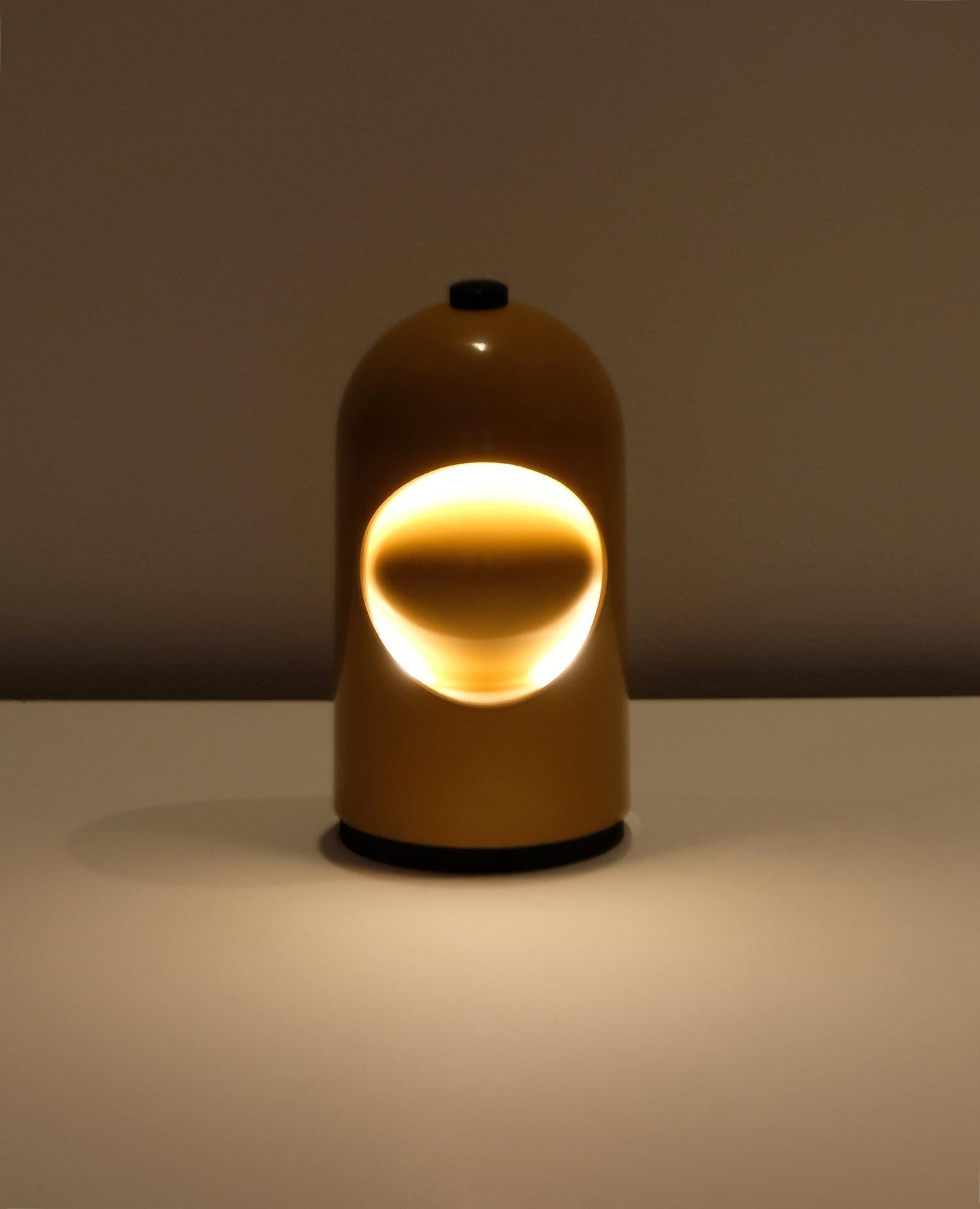 Ochre enameled Selene Eclipse lamp by ABM (this lamp was also manufactured for Lightolier’s USA market in the 1960’s). 

Tested original E-14 bulb European socket, cord, on/off switch, and grounded north American plug. Minor tarnish, dings, scuffs,