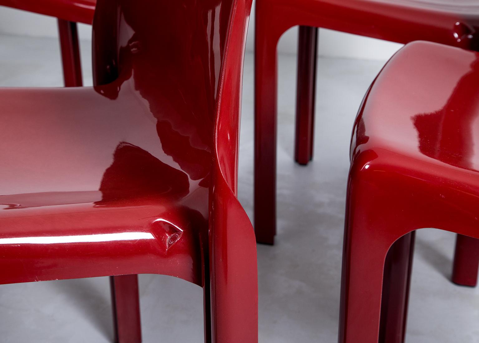 Plastic Selene Stacking Chairs by Vico Magistretti for Artemide in Dark Red