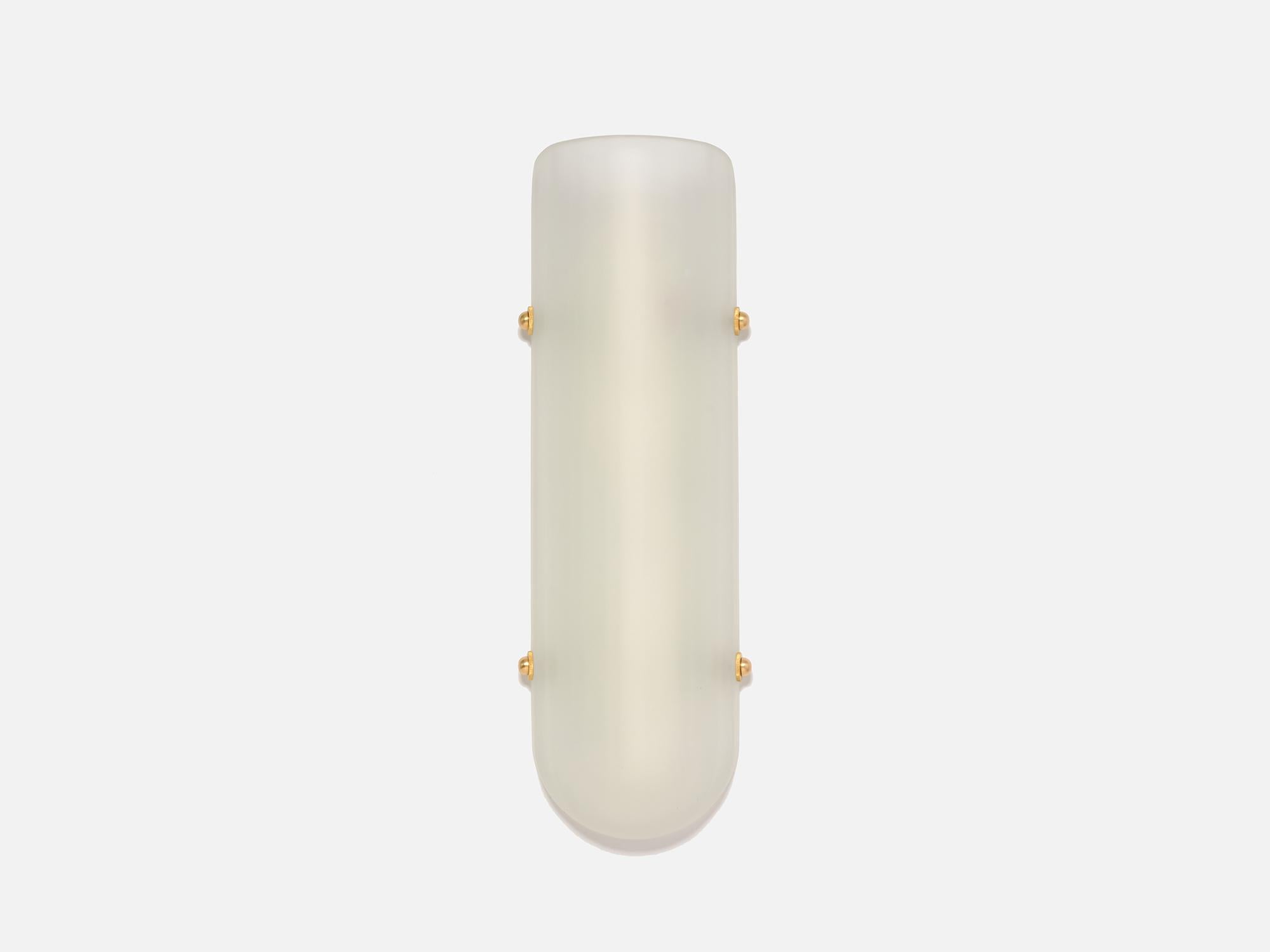 Inspired by Art Moderne, the Selene sconce is part of Bianco light and space, streamline series. Composed of mold blown faceted glass shown in enamel white and brass hardware with LEDs providing a warm directional light maximizing efficiency and