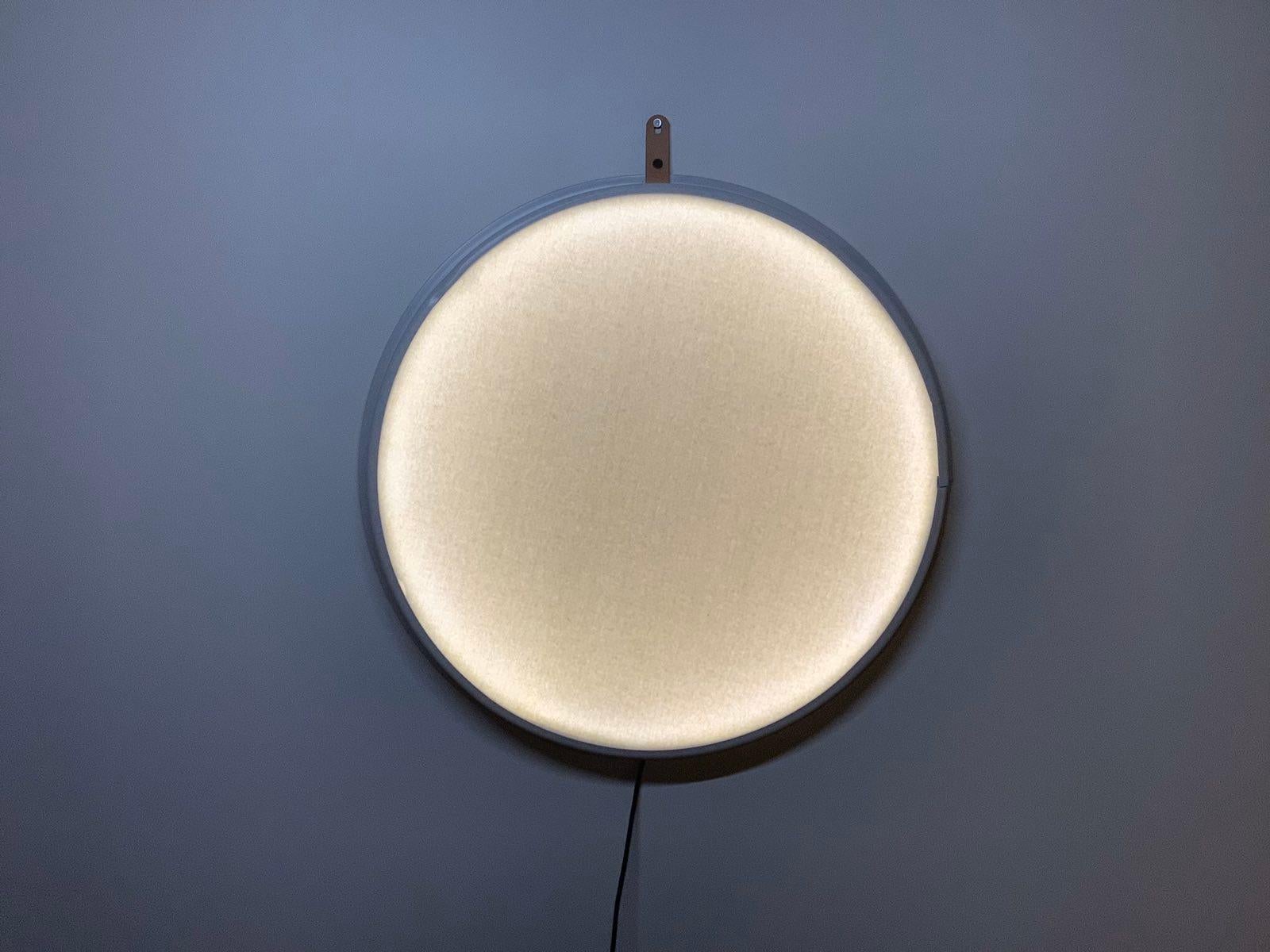 Selene wall lamp by Studio Lampent
Edition of 5
Dimensions: D 62 x H 6 cm
Materials: upcycled metal ring, acrylic, felt
Weight: 2.8 kg.

All our lamps can be wired according to each country. If sold to the USA it will be wired for the USA for