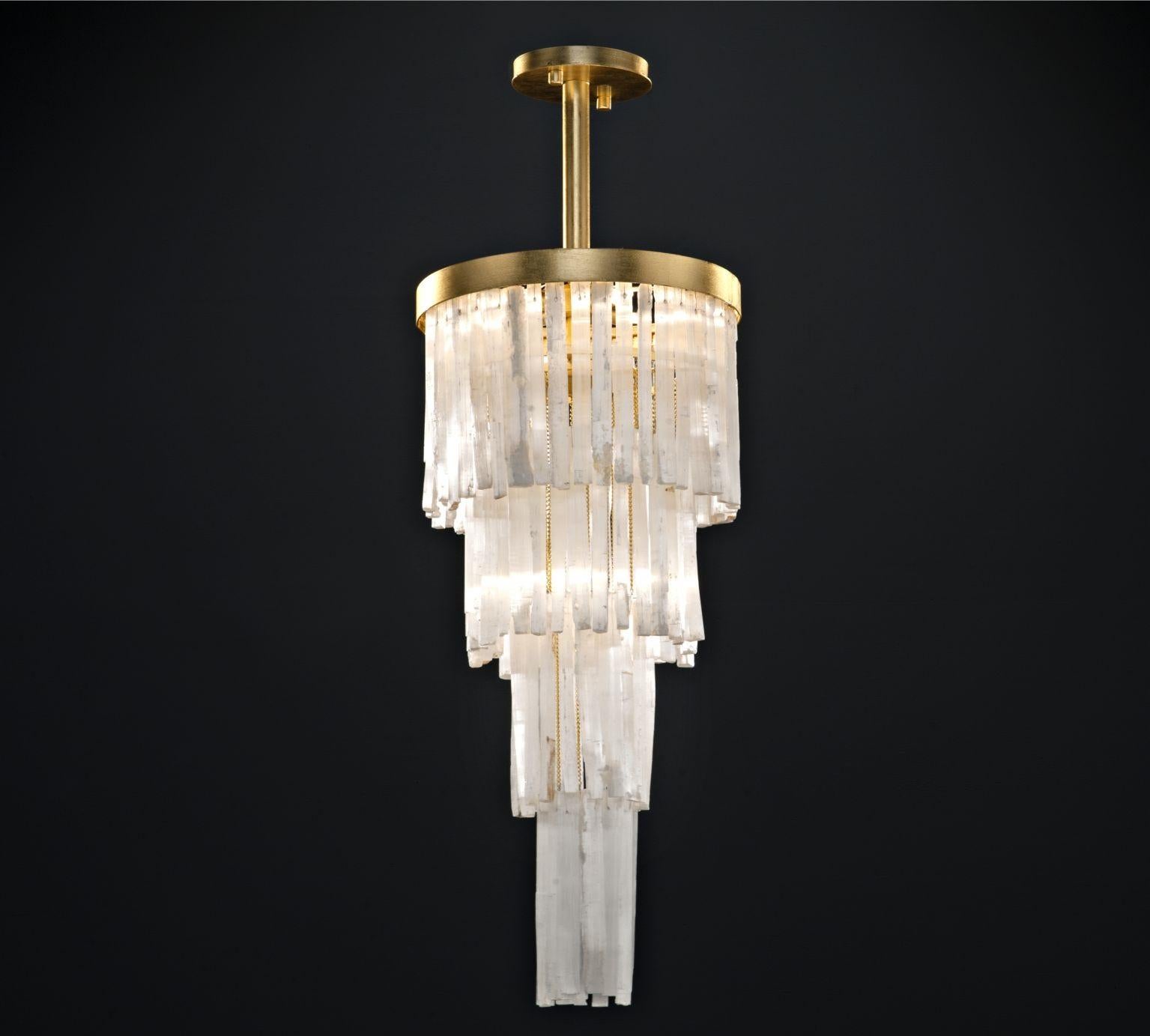 Selenite chandelier by Aver
Dimensions: D 38 x H 75 cm.
Materials: Selenite, metal.
Available in other sizes.

Designed by Marcele Muraro, for Aver, the collection is produced with natural Moroccan selenite and inspired by the city of