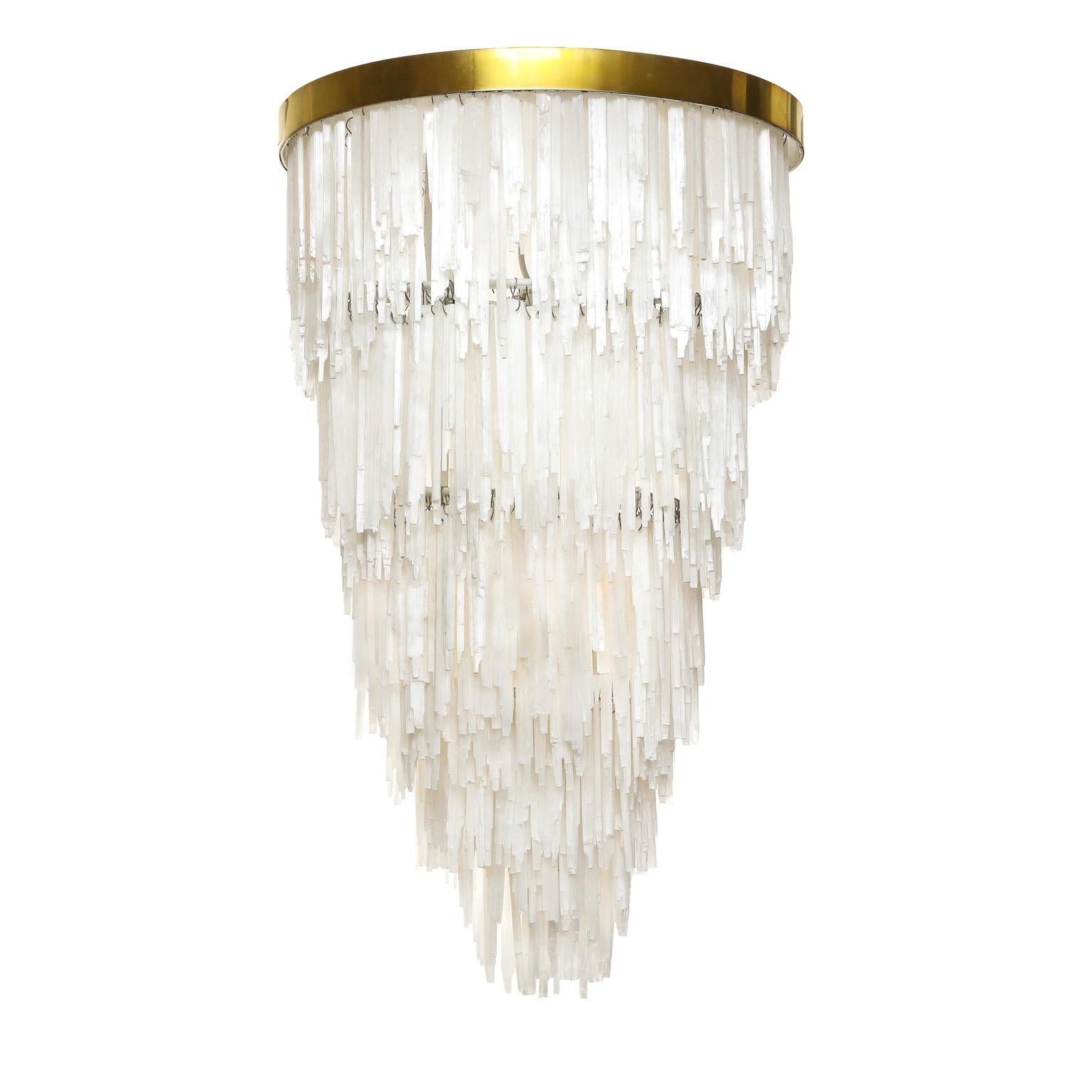 Striking tiered chandelier of cascading Selenite crystals with brass body and canopy. Italian, 1970's.