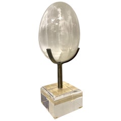 Selenite Crystal Quartz Egg Mounted on Steel 
Lucite