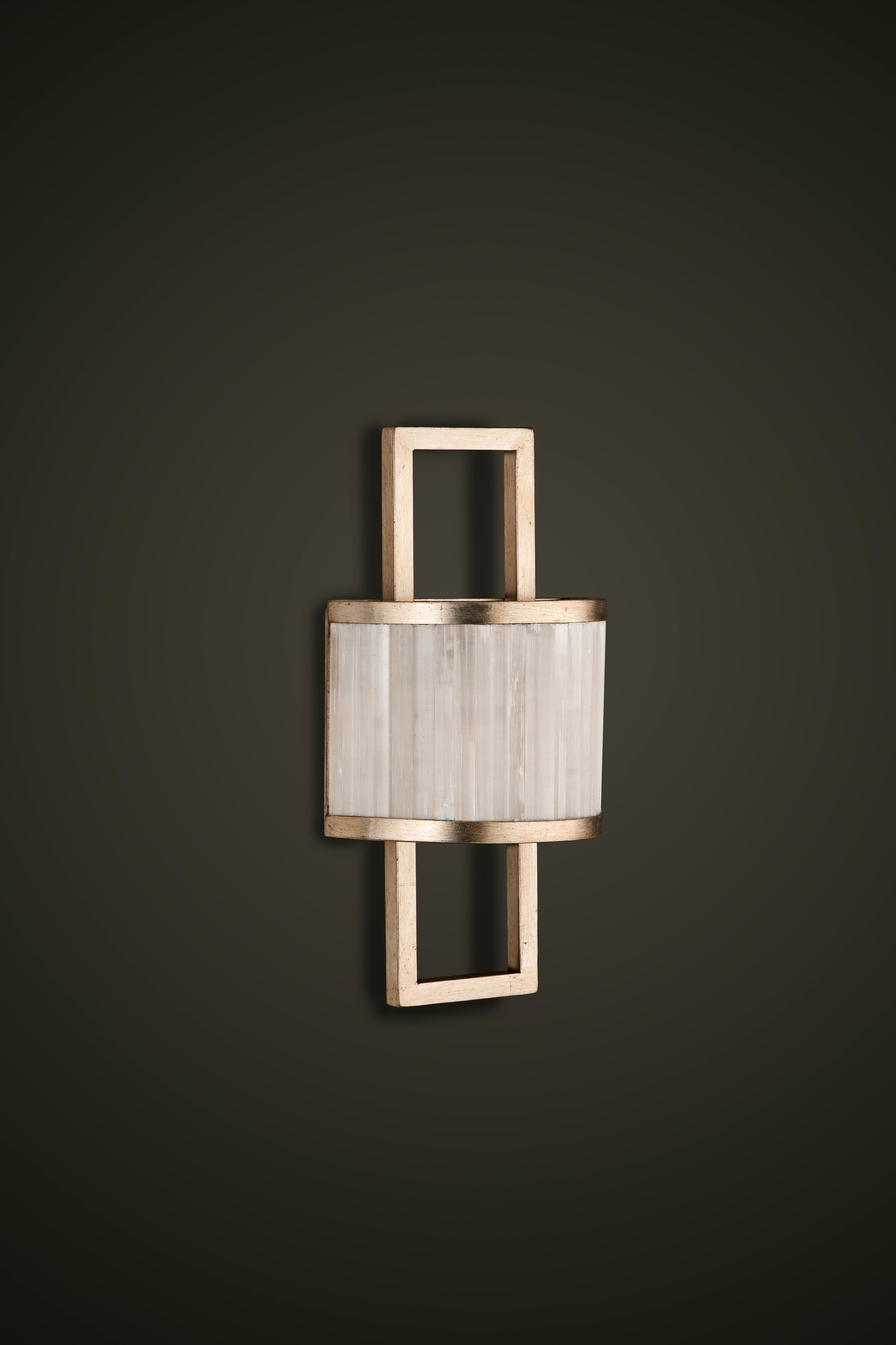 Selenite wall sconce by Aver
Dimensions: D 16 x W 26 x H 59 cm
Materials: Selenite, metal.
Also Available: silver leaf, antique silver leaf, gold leaf, brass leaf, copper leaf, pink gold leaf.

Cylindrical wall sconce with a beautiful manual
