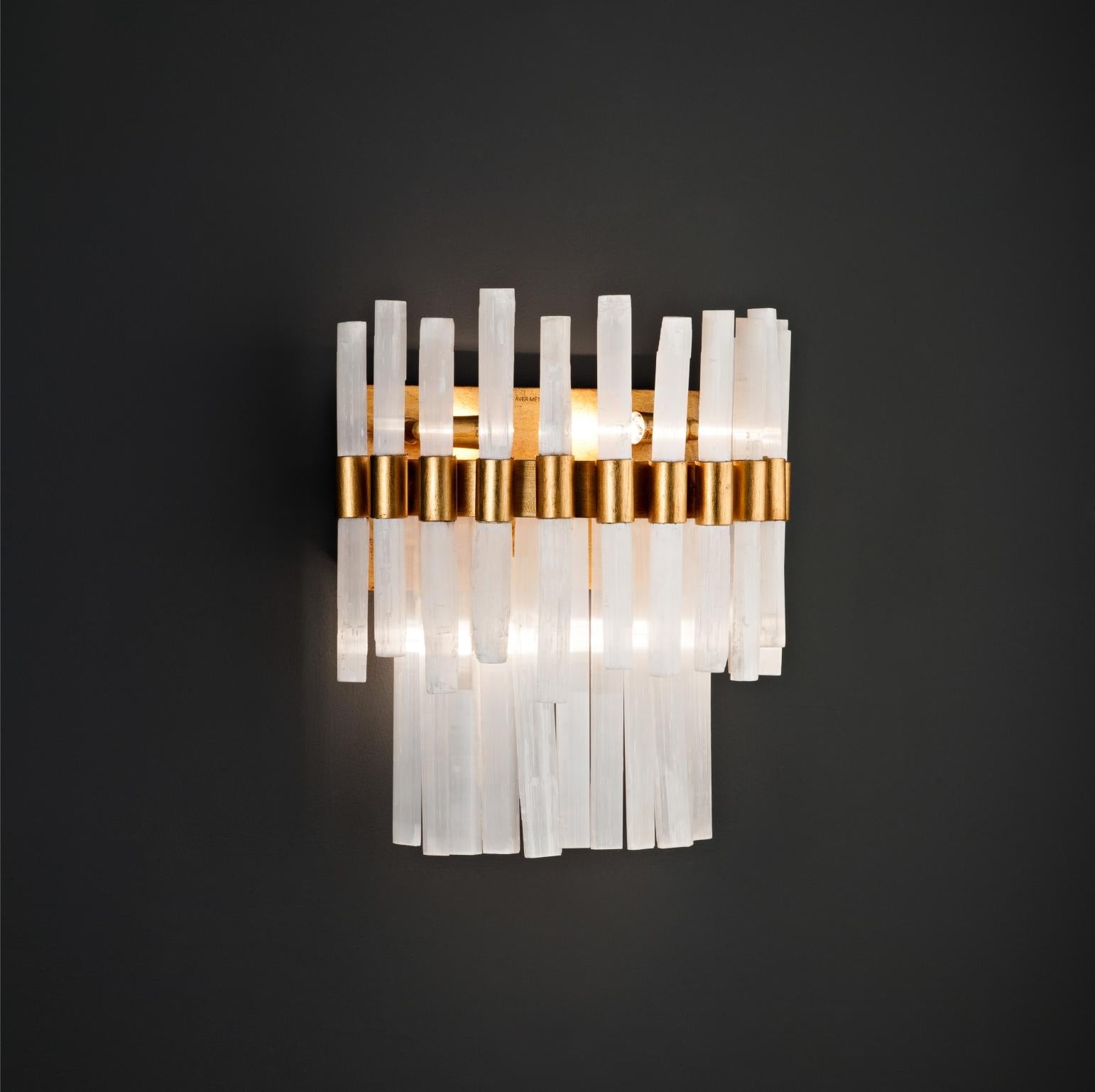 Selenite wall sconce by Aver
Dimensions: D 19 x W 28 x H 35 cm.
Materials: Moroccan natural selenite rock, metal.
Lighting: 4 x G9
Finishes: Gold Leaf, Silver Leaf, Warm Gold Leaf, Warm Silver Leaf, Warm Copper Leaf, Dark Gold Leaf, Dark Silver