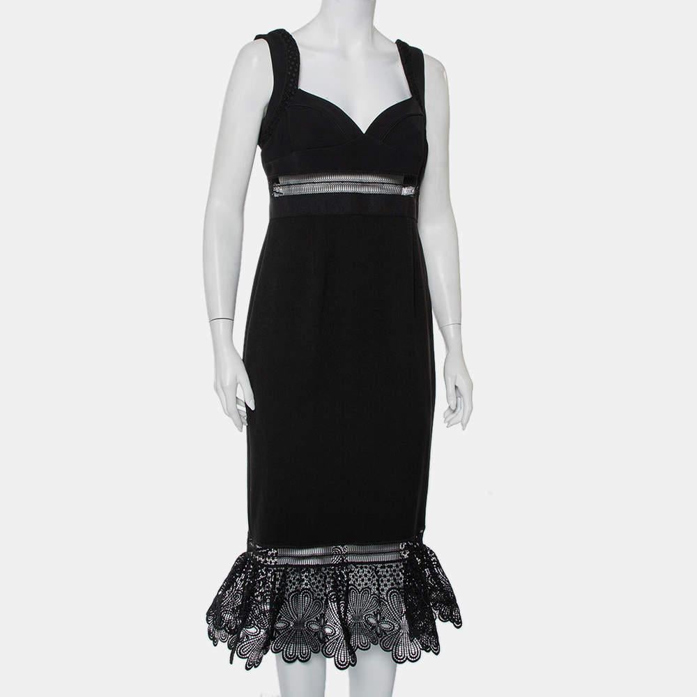 The elegance and femininity that this Self Portrait dress exudes are unmatchable. The creation features a sweetheart neckline  a sheer panel for the skin to subtly peek above the waistline. The black dress is finished off with a flounced hemline