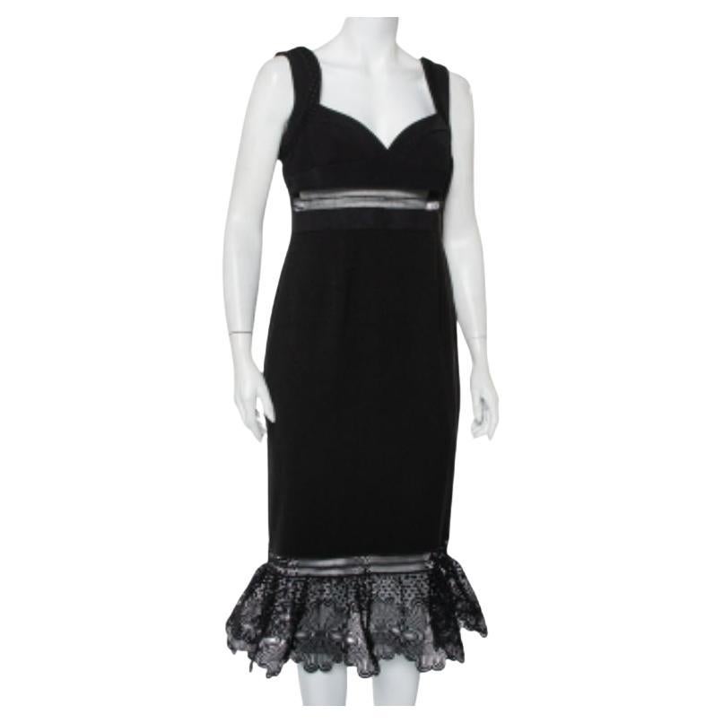 The elegance and femininity that this Self-Portrait dress exudes are unmatchable. The creation features a sweetheart neckline, a sheer panel for the skin to subtly peek above the waistline. The black dress is finished off with a flounced hemline