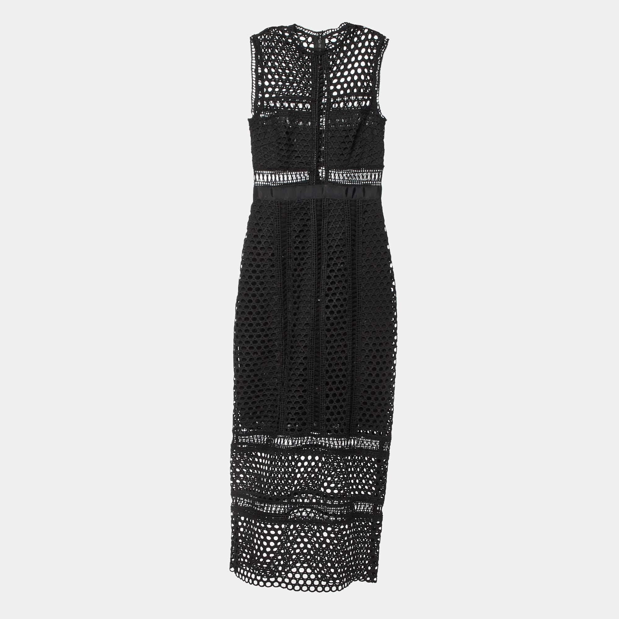 This Self Portrait midi dress exudes elegance and sophistication. Its flattering length falls between the knee and ankle offering a versatile option for various occasions. With its chic design it combines modern trends with timeless charm making it