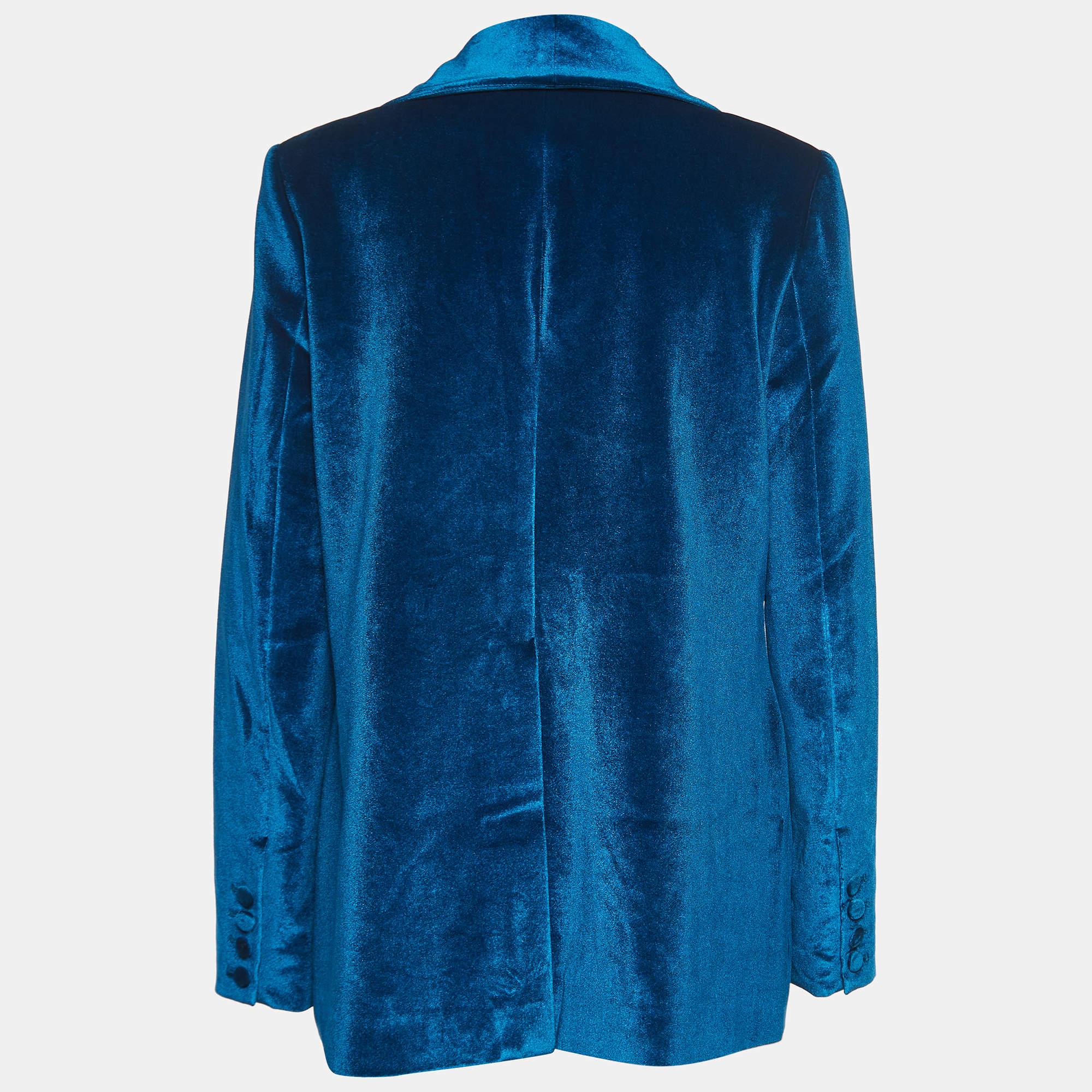  In this self-portrait, the subject dons a luxurious blue velvet blazer that exudes sophistication and confidence. The deep, lustrous hue complements the wearer's demeanor, creating a striking visual impact. The blazer's tailored fit accentuates the