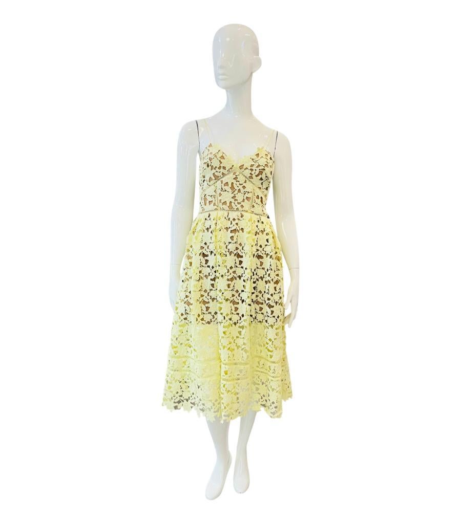 Self-Portrait Guipure Lace Dress
Light yellow 'Azaela' dress designed with textured guipure lace panels.
Featuring spaghetti straps, A-Line midi skirt with cinched waist and V-Neckline.
Detailed with nude coloured lining and concealed zip closure to