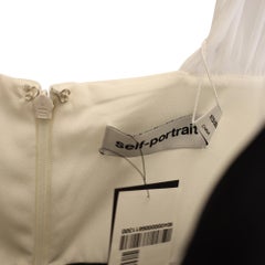 Robe bicolore « Self-Portrait Midi » à nœud, en crêpe noir et blanc
