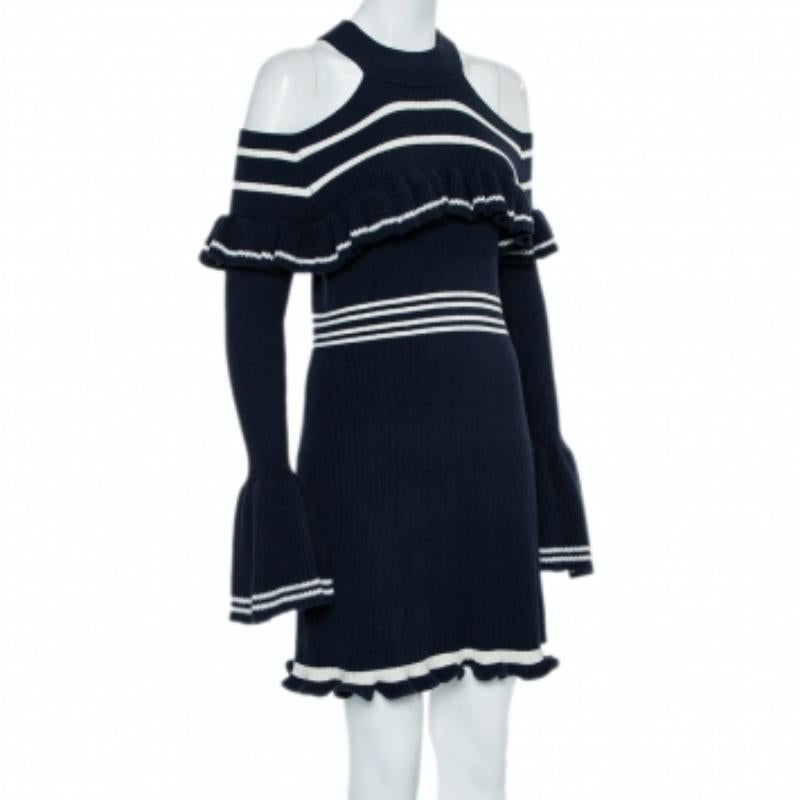 Self Portrait brings to you this amazing dress that is perfect to add to your luxe wardrobe. The navy blue rib-knit creation features ruffle trim details and flaunts cold shoulders and long sleeves. It is sure to lend you a fantastic fit!