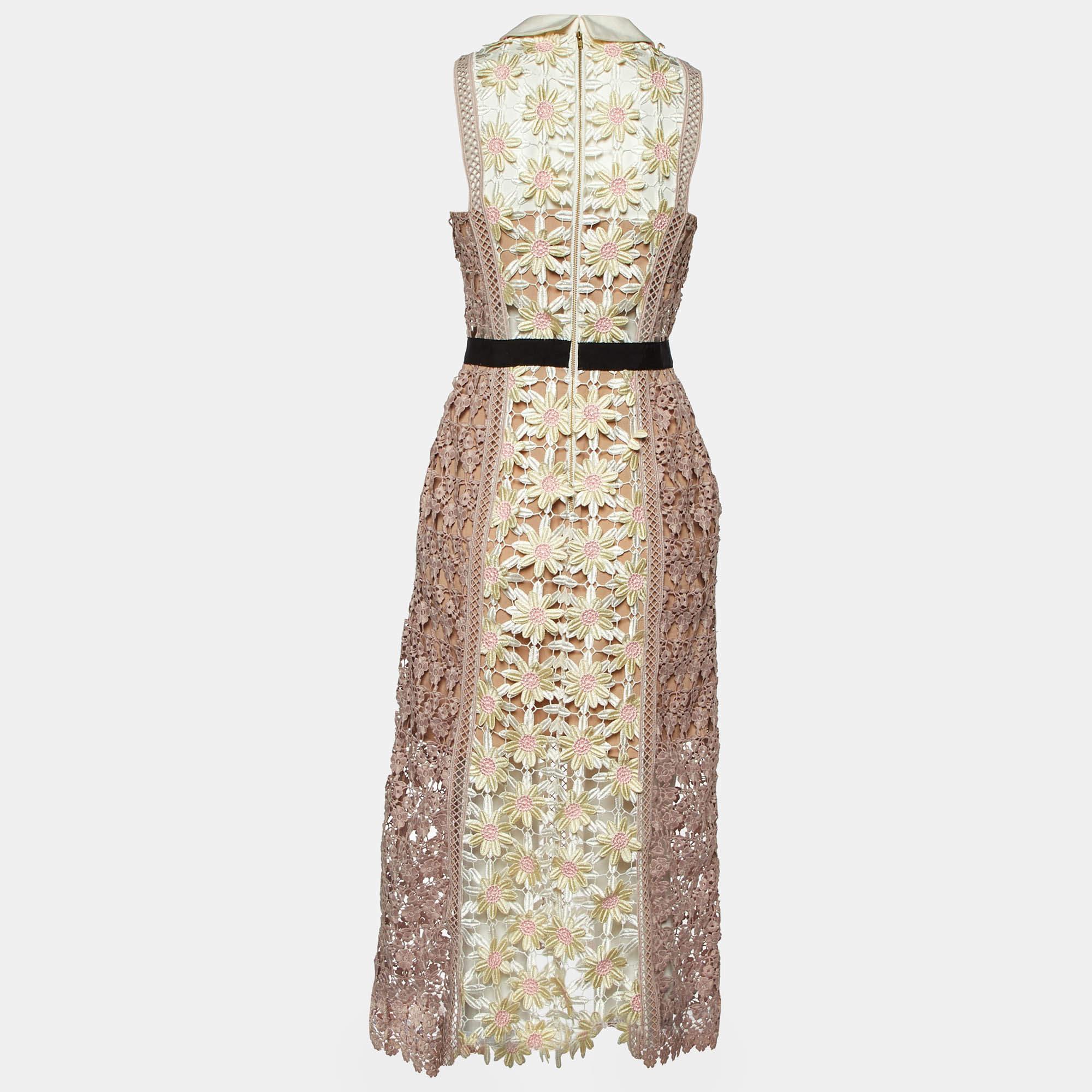 This Self Portrait midi dress exudes elegance and sophistication. Its flattering length falls between the knee and ankle offering a versatile option for various occasions. With its chic design it combines modern trends with timeless charm making it