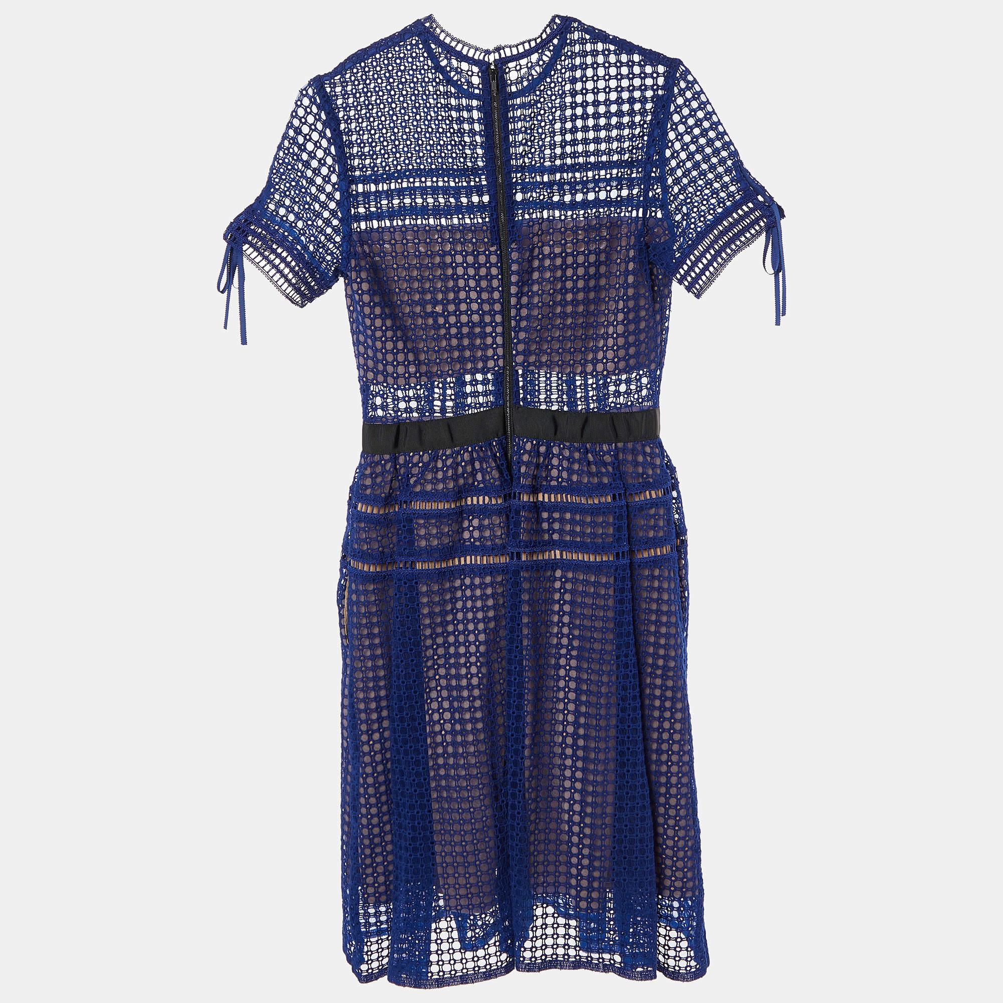 This designer dress is a chic and stylish garment that exudes elegance and sophistication. With its sleek design flattering silhouette and high quality craftsmanship this dress is perfect for any special occasion or evening event ensuring you stand