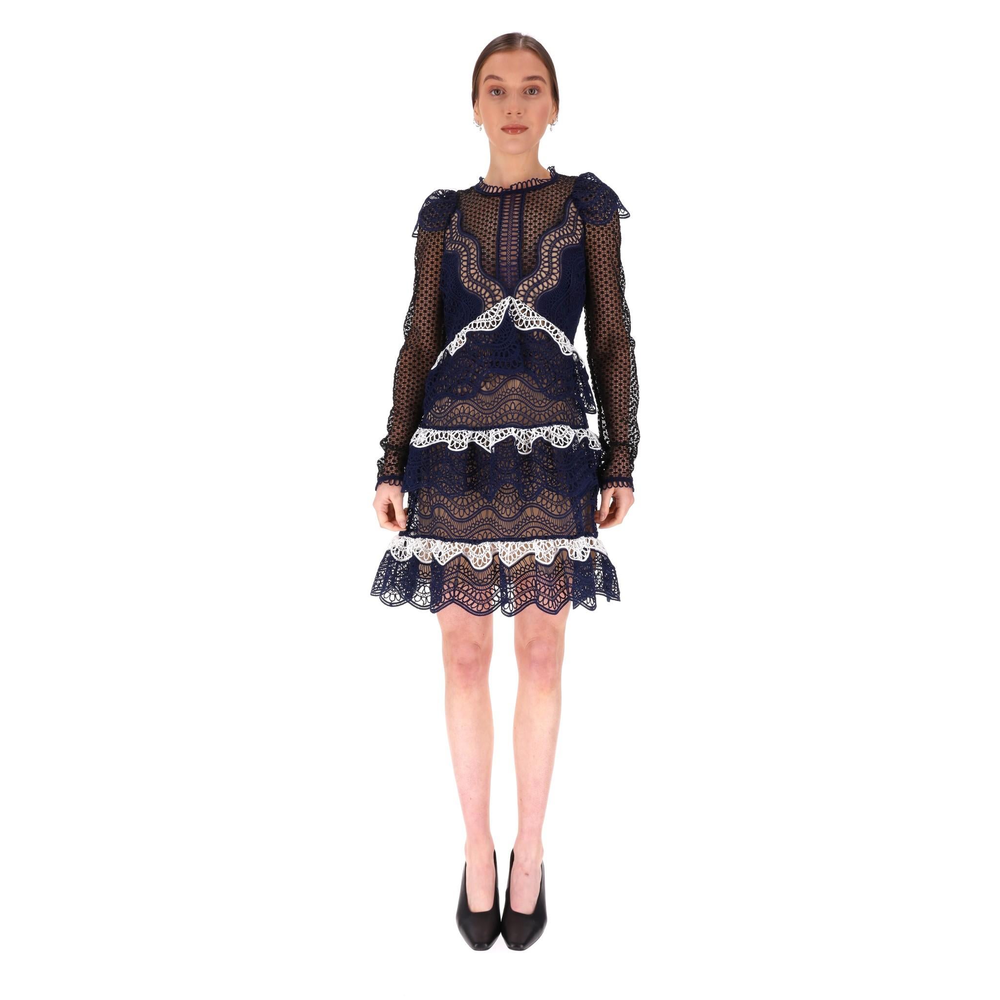 Self-Portrait Tiered Guipure Lace Dress

Navy, tiered dress with all-over guipure lace designs.

Contrast white detailed ruffles, long sleeves and crew-neckline, beige lining.

Rrp Approx. £380

Size – 12UK 

Condition – Very Good

Composition –