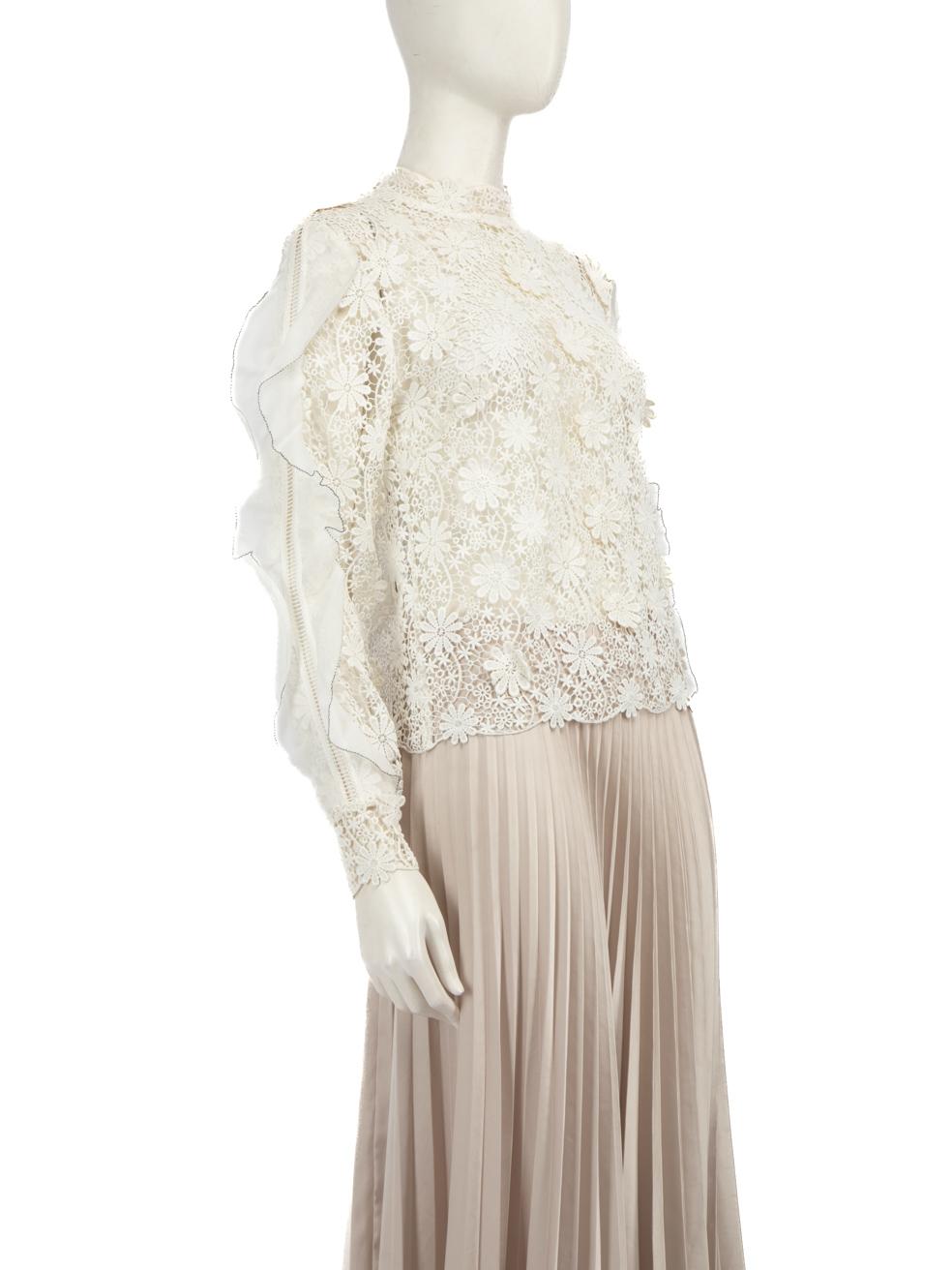 CONDITION is Very good. Minimal wear to the top is evident, there is overall discolouration mainly on the sleeves and underneath the flower details on this used Self-Portrait designer resale item.
  
  Details
  
  
  White 
  
  Polyester 
  
  Top