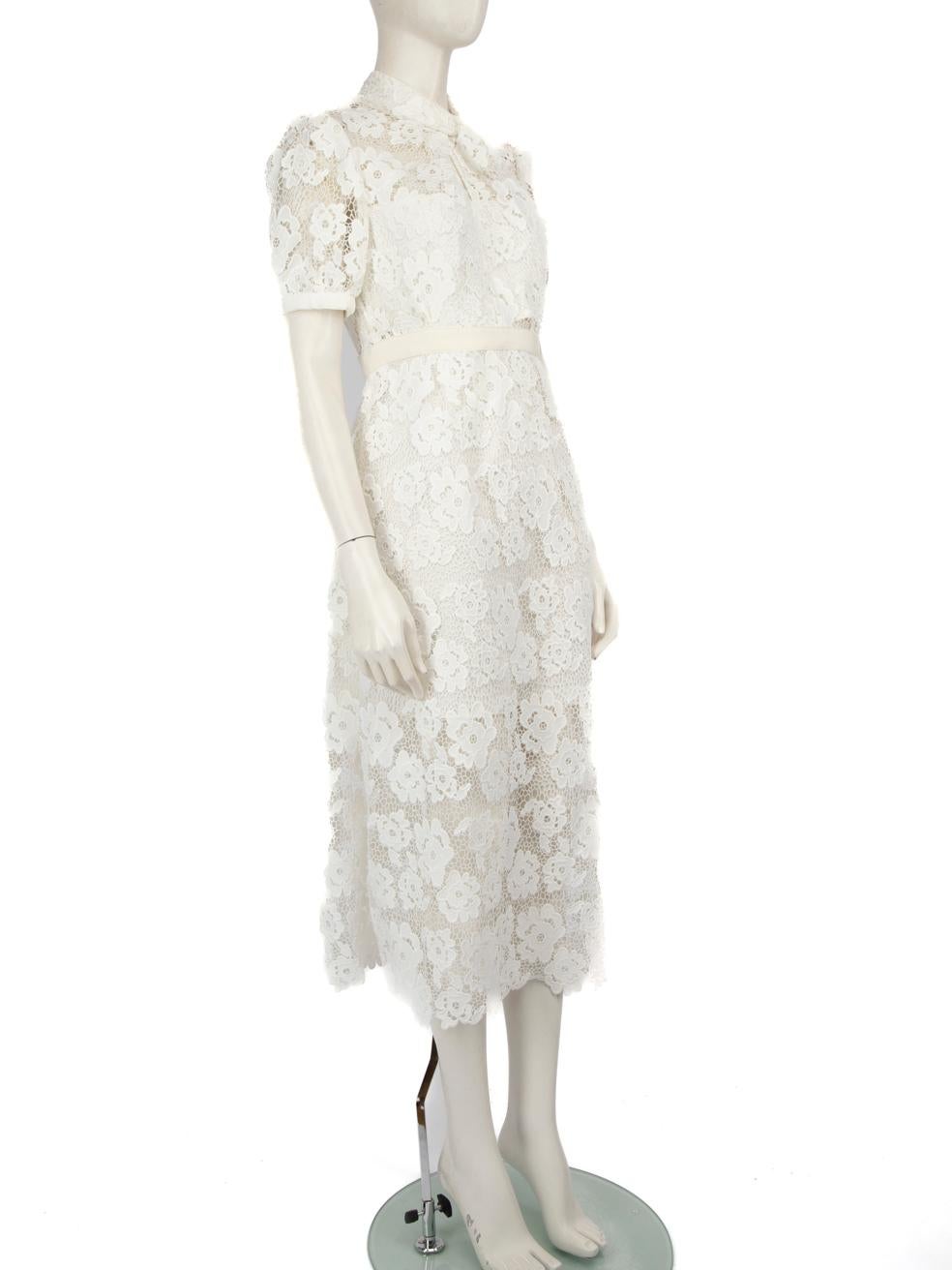 CONDITION is Never worn, with tags. Due to poor storage of the dress, there is Discolouration around the inside of both sleeve cuffs, the inside of the neckline and the inside of the waist band on this used Self-Portrait designer resale item.