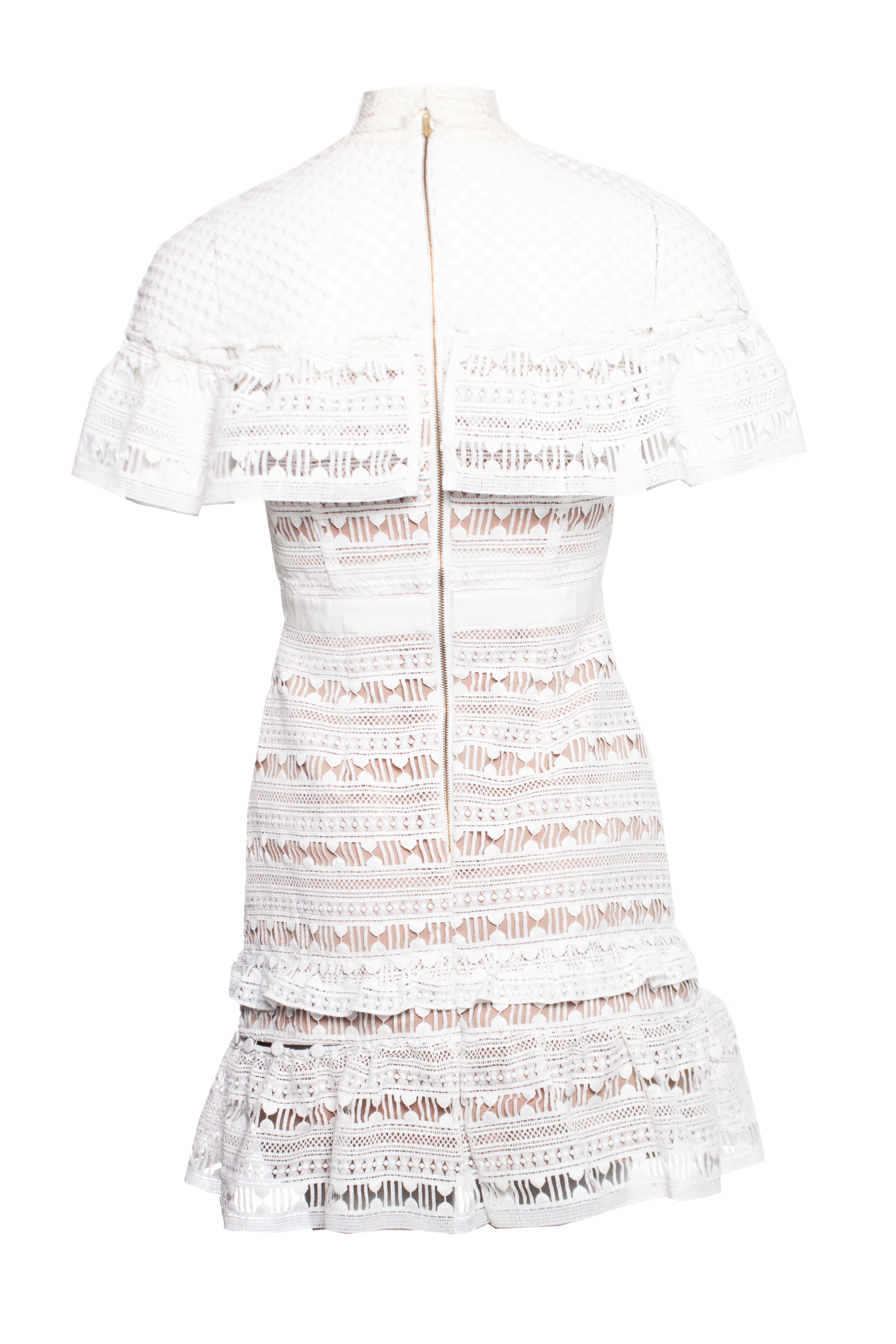 Self Portrait, White ruffled lace mini dress. This piece is in very good condition. small make up stains around the neck on the inside

• CONDITION: very good condition

• SIZE: UK 10 - S

• MEASUREMENTS: length 83 cm, width 42 cm, waist 35 cm,