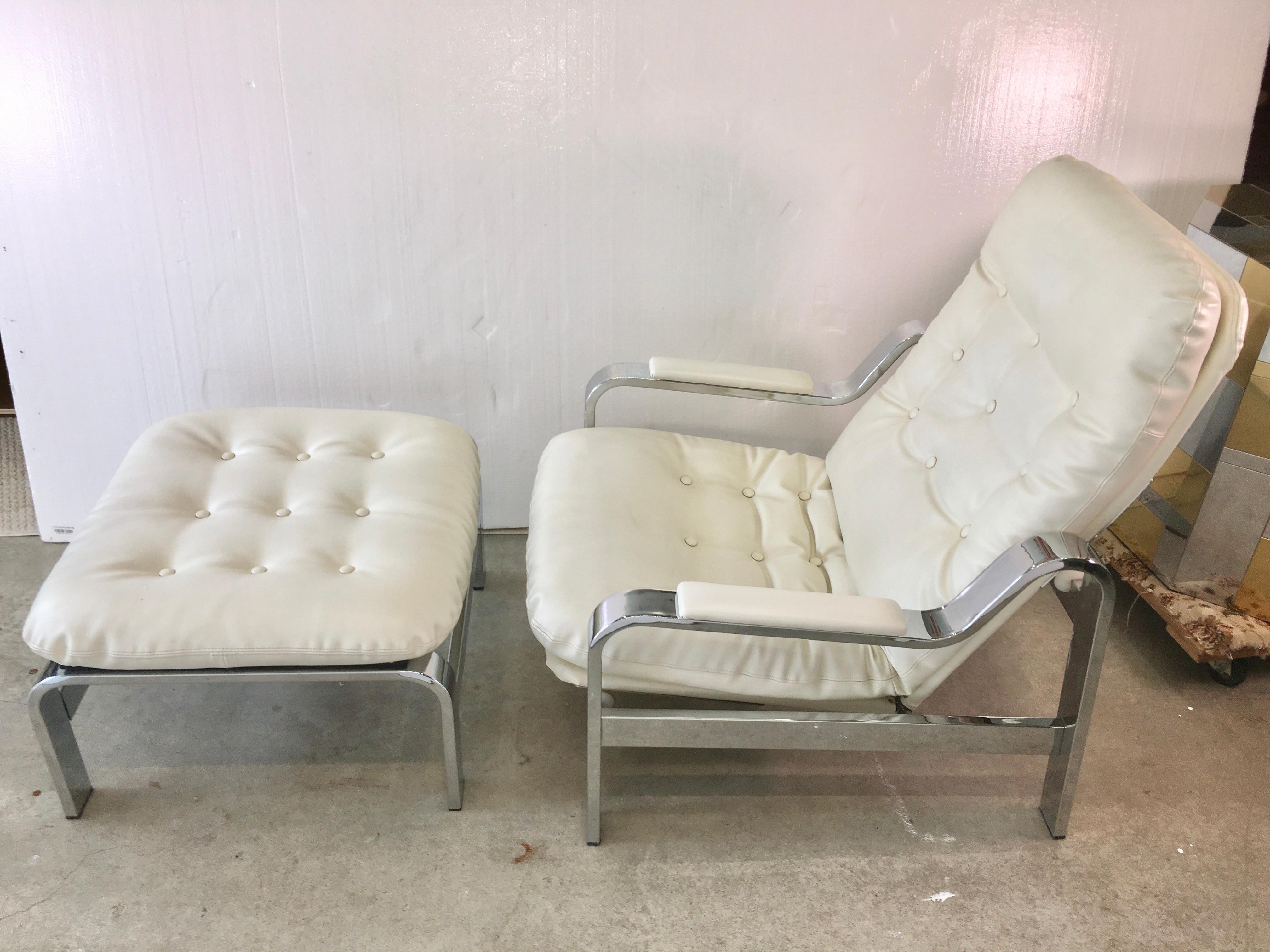 Stylish chrome frame reclining armchair and ottoman imported from Italy by Selig Manufacturing Co. Inc., mid-1970s.
Upholstered cushions in saddle stitched button-tufted near white Italian leather.
Very clean. Chrome is bright and shiny. All