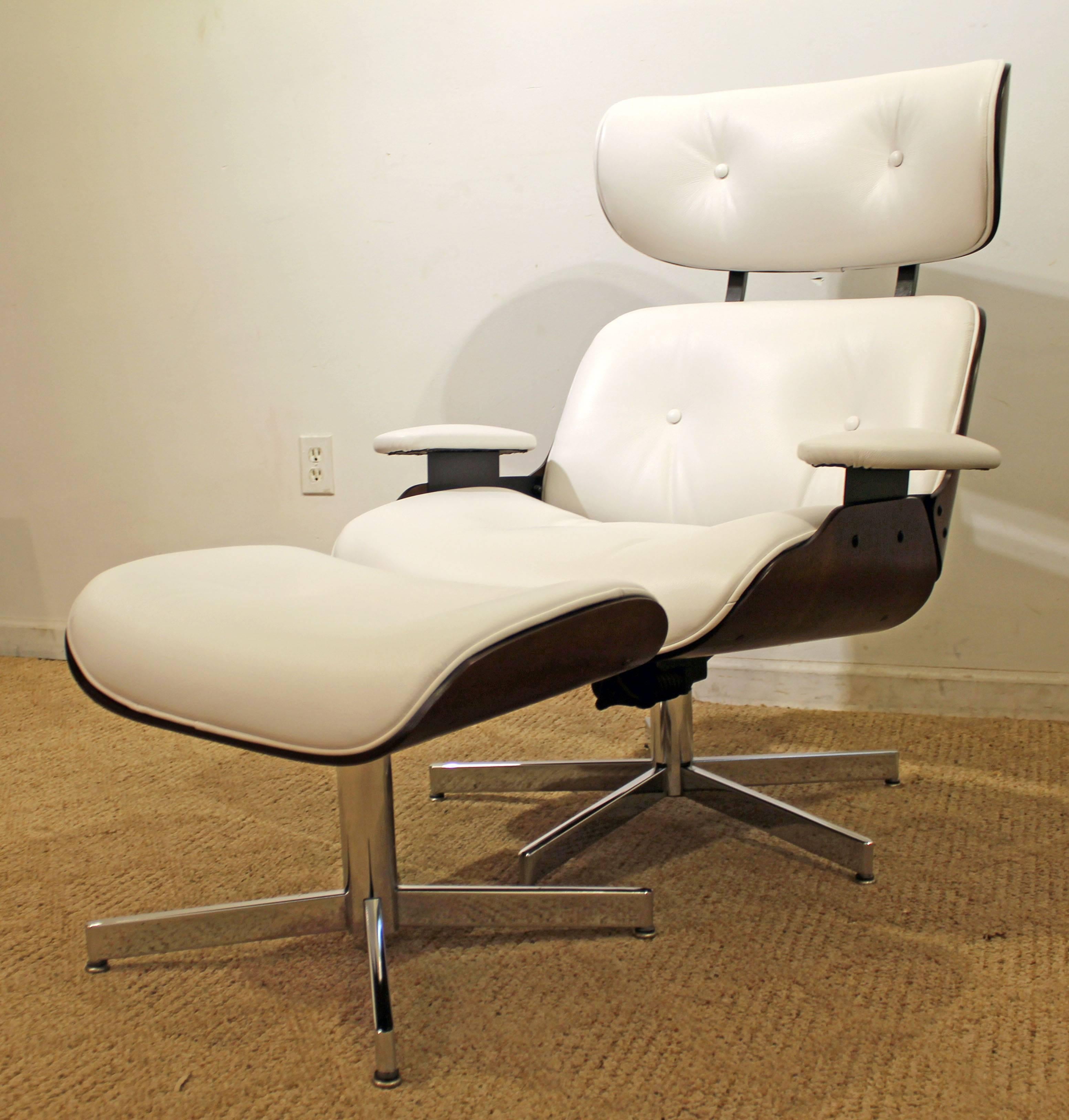 Offered is a Selig Eames lounge chair and ottoman. This chair is an original Selig. It has been completely restored with new white Redondo leather and refinished walnut.