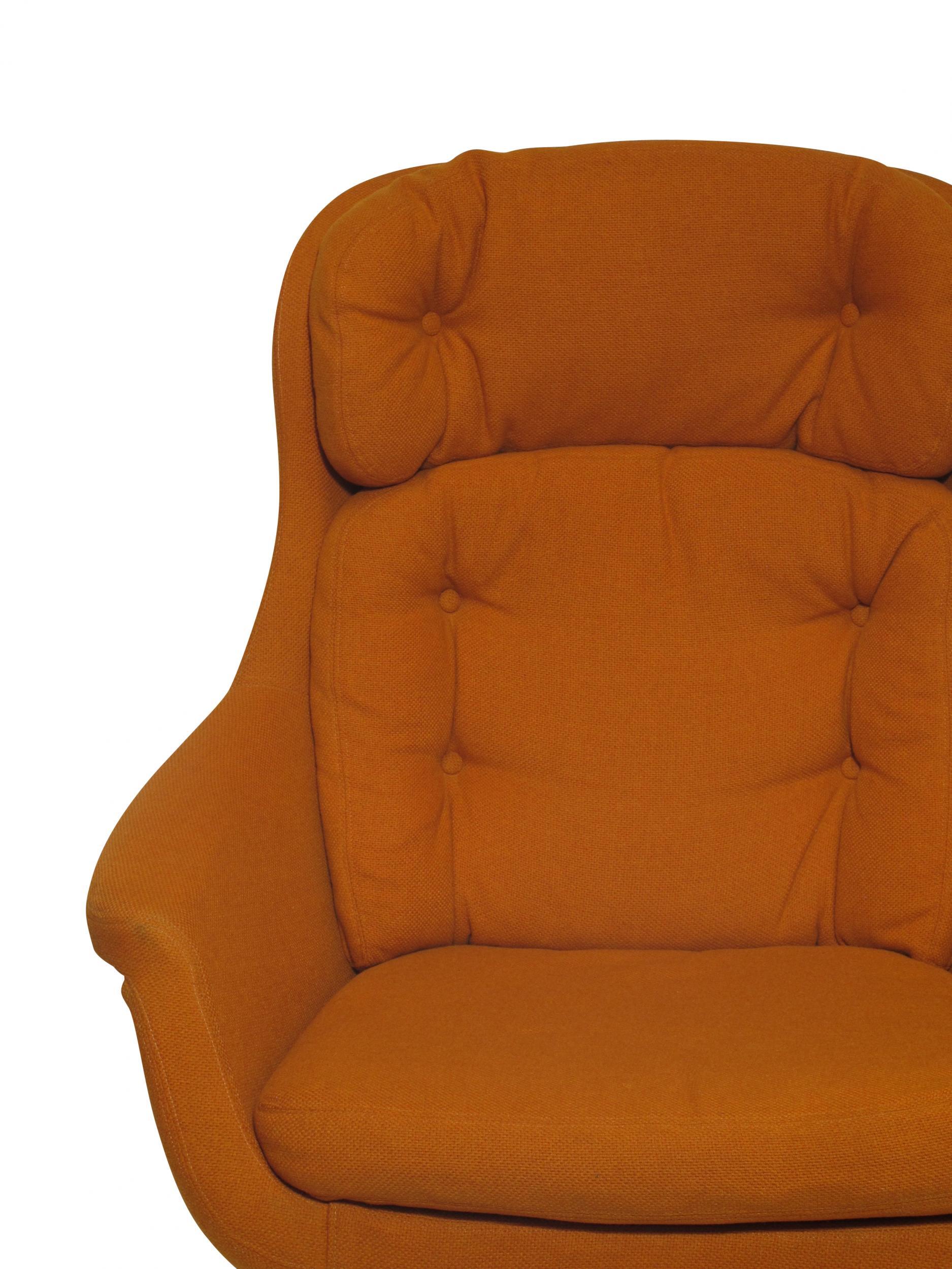 Midcentury chair for Selig manufactured in Sweden. Chair swivel and tilts and in original orange textile.