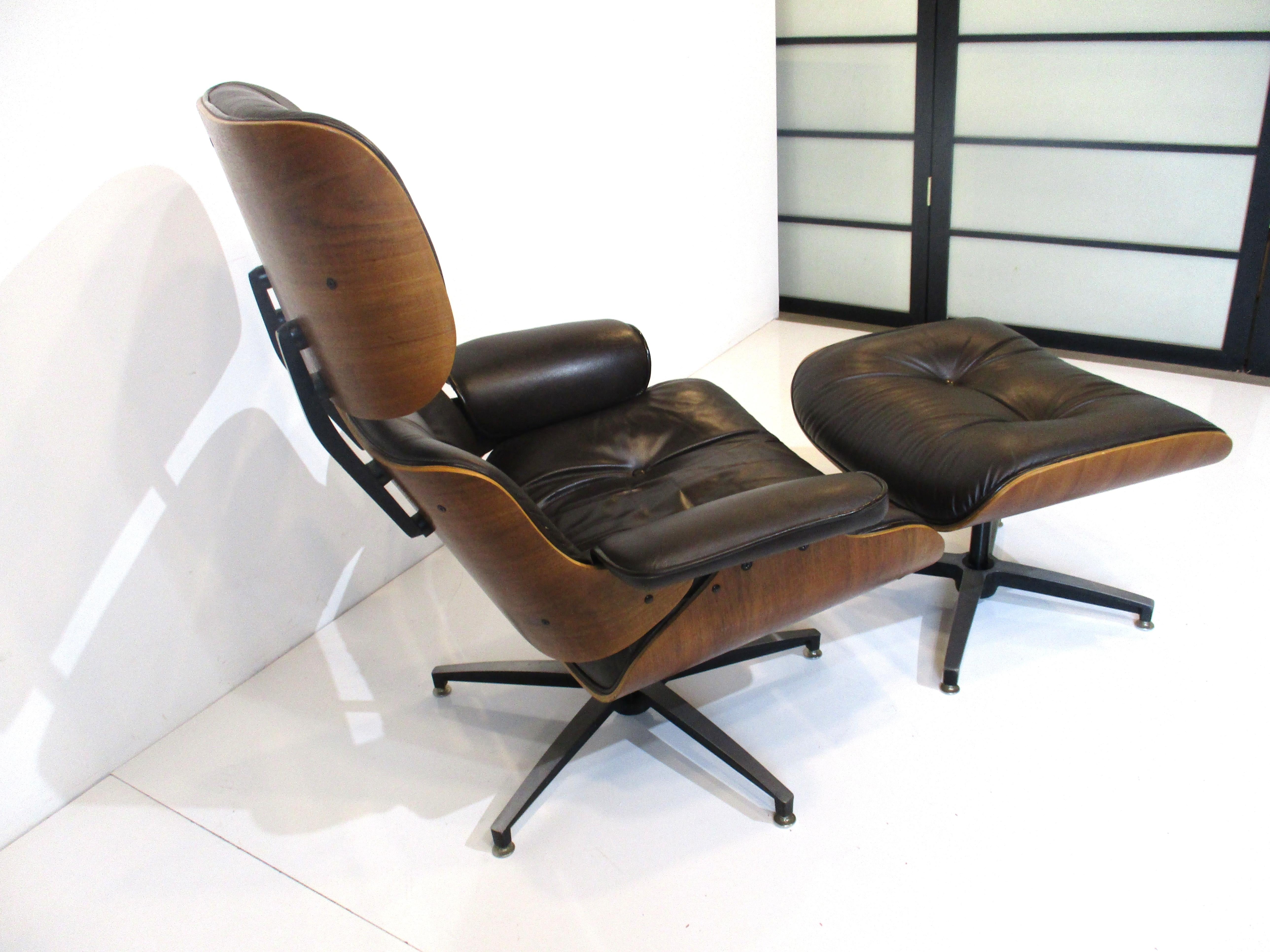 A wonderful walnut lounge chair with matching ottoman in a dark chocolate leather combined with the walnut gives this set a rich and lush look and feel. The chair has a higher profile back perfect for a taller person and an adjustable spring to the