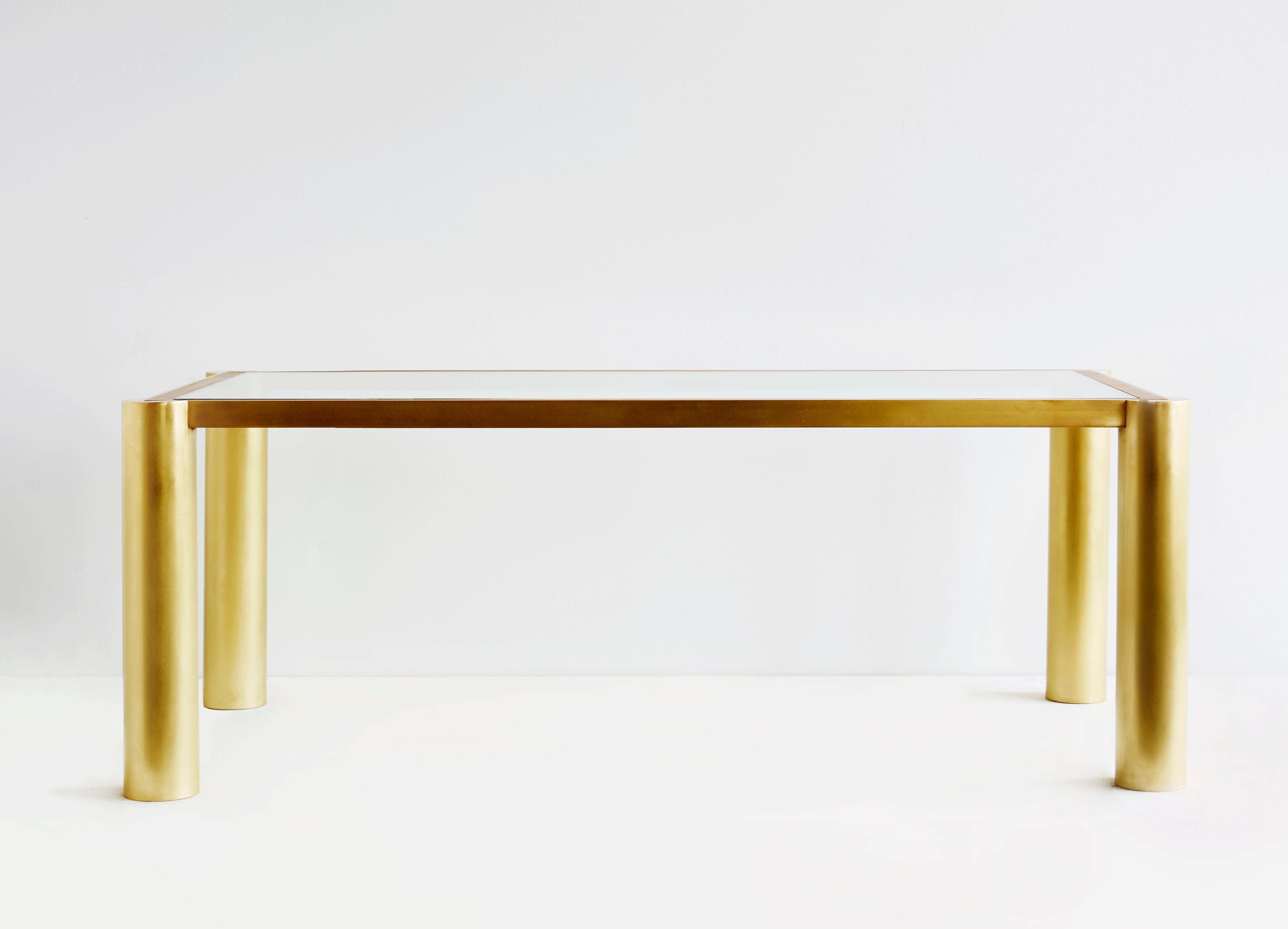 Seline table in walnut and brass by Cam Crockford

Additional information:
Materials: Walnut, brass
Dimensions: 48 W x 24 D x 15 H inches.