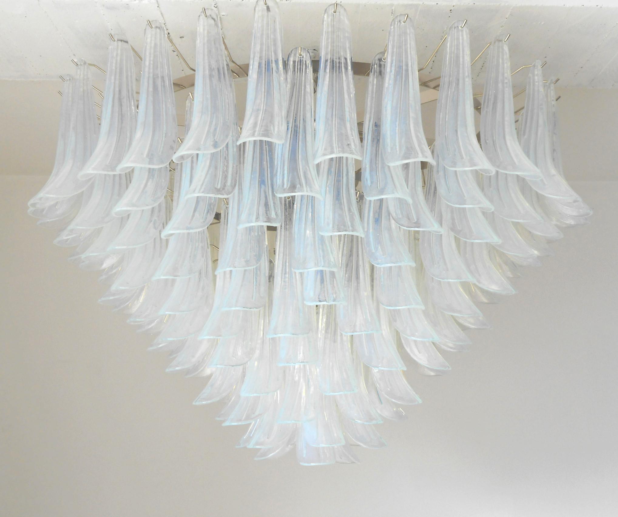 Italian chandelier shown with iridescent opaline Murano glass petals mounted on chrome finish frame / Designed by Fabio Bergomi for Fabio Ltd, inspired by Mazzega / Made in Italy
21 lights / E26 or E27 type / max 60W each
Measures: diameter 47