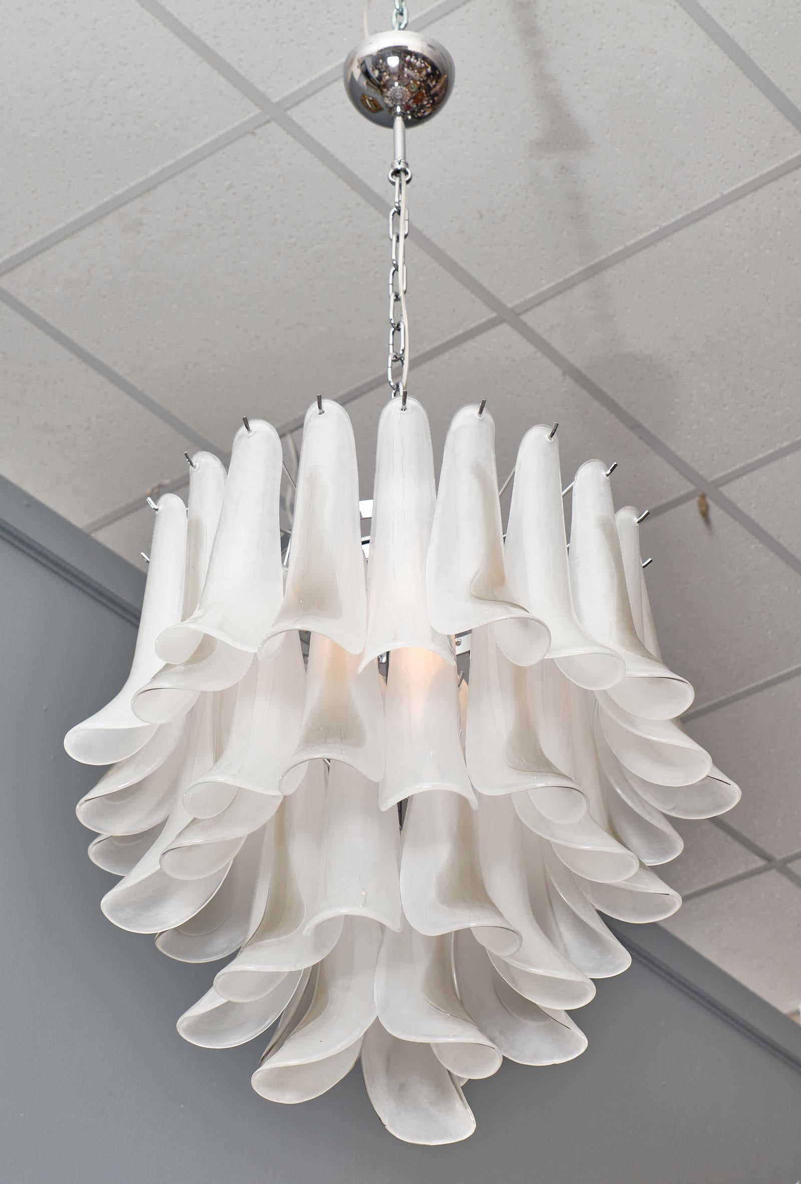 Murano glass “selle” chandelier with a chrome structure with alternating white frosted glass pendants and white frosted glass pendants with a pewter translucent layer. This piece has been newly wired to fit US standards.

This piece is currently