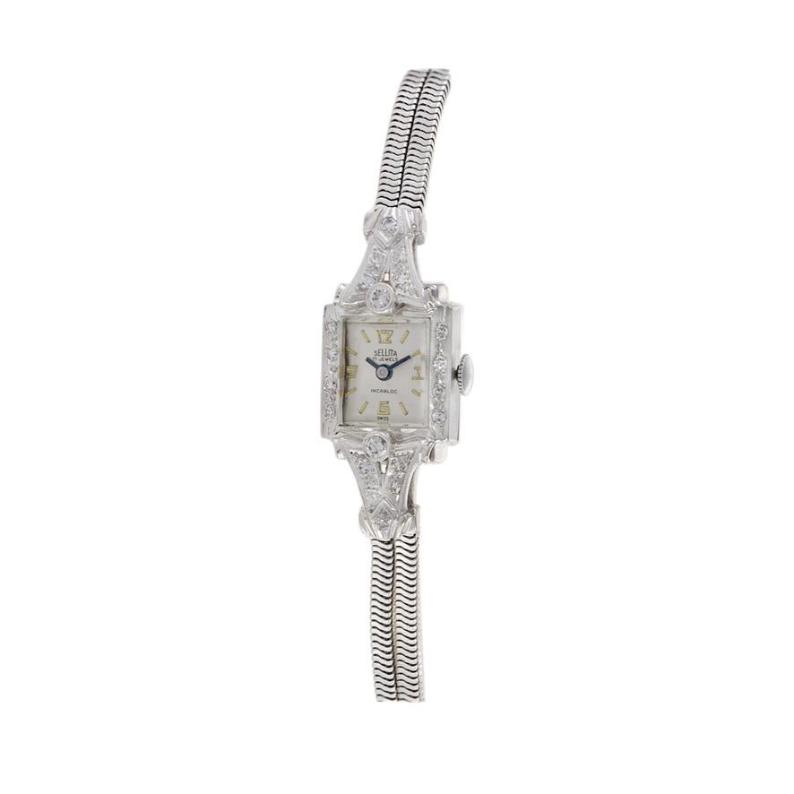 This is a beautiful 1950's Swiss made Sellita Cocktail Watch. The watch is. 14K white gold and is decorated with 0.50TDW of high quality diamonds.

Sellita to this day is considered one of the top movement makers in the world. This watch is powered