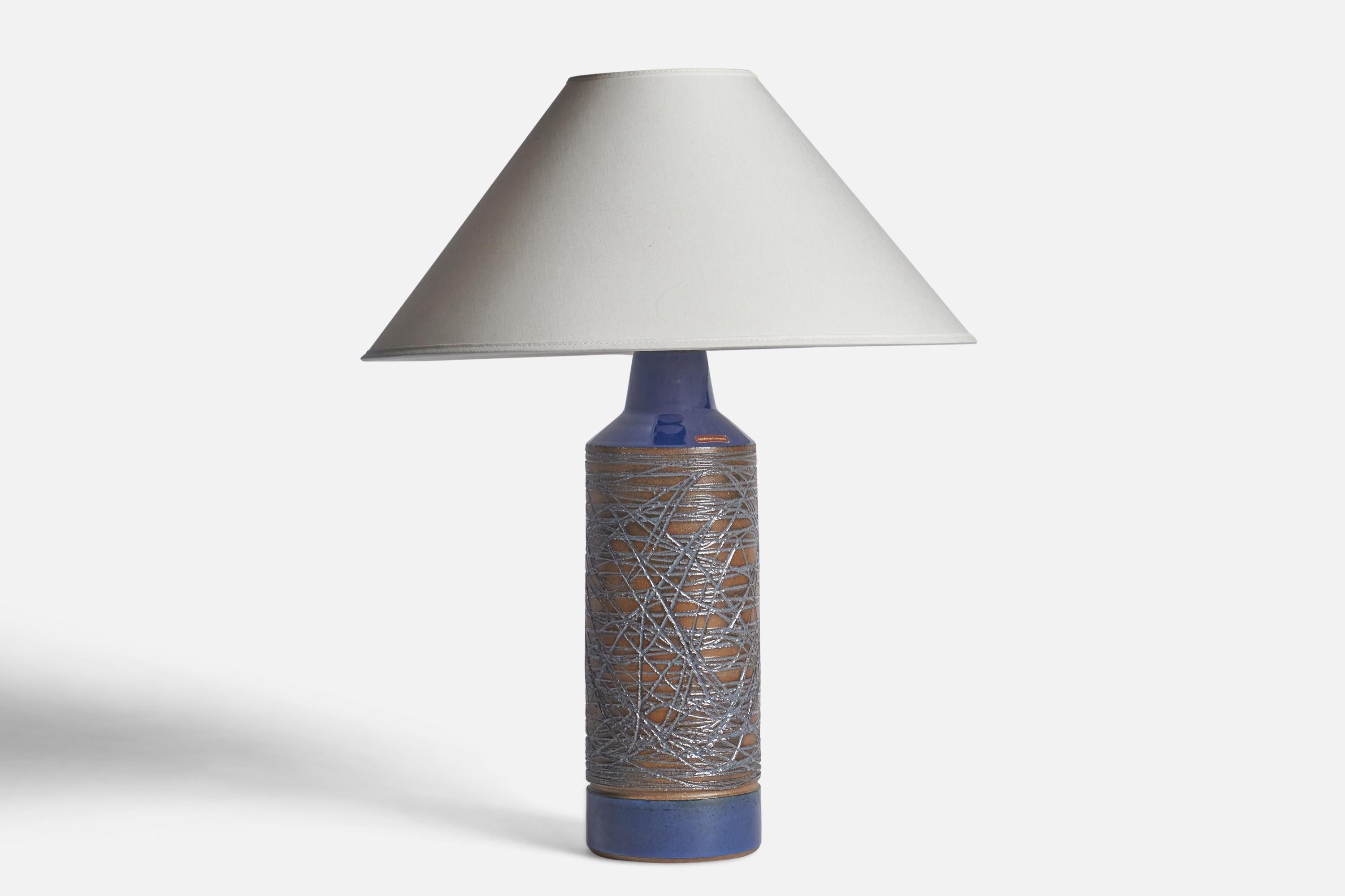 A blue, brown-glazed and incised table lamp designed and produced by 
Selsbo, Simlångsdalen, Sweden, 1960s.

Dimensions of Lamp (inches): 15.25