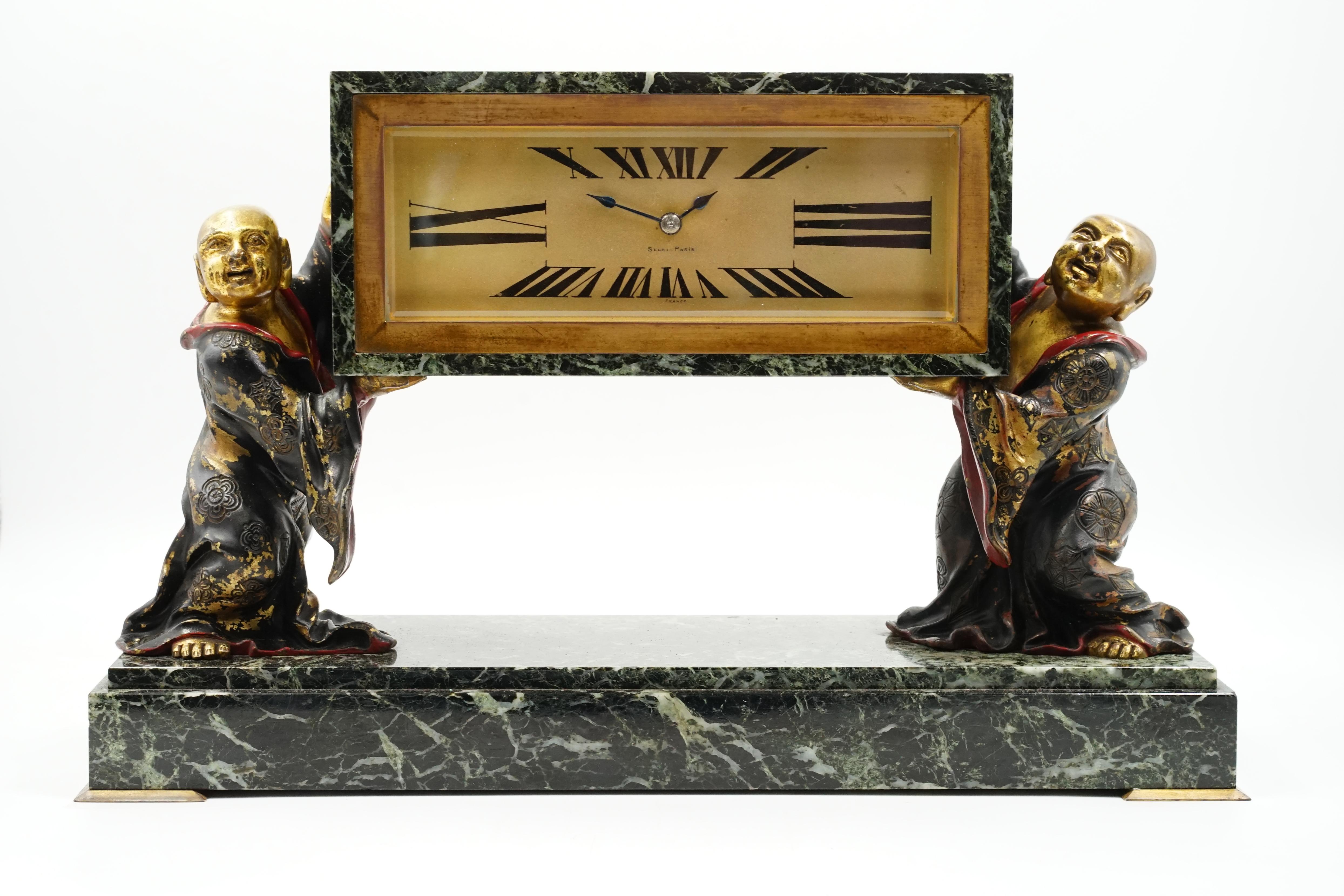 Selsi Paris Art deco table clock
French designer watch made by Selsi Paris
Art deco style with Chinese motifs
Rectangular dial with Roman numerals
Clock held by 2 Chinese children
with very fine enamel details
The marble is in excellent condition