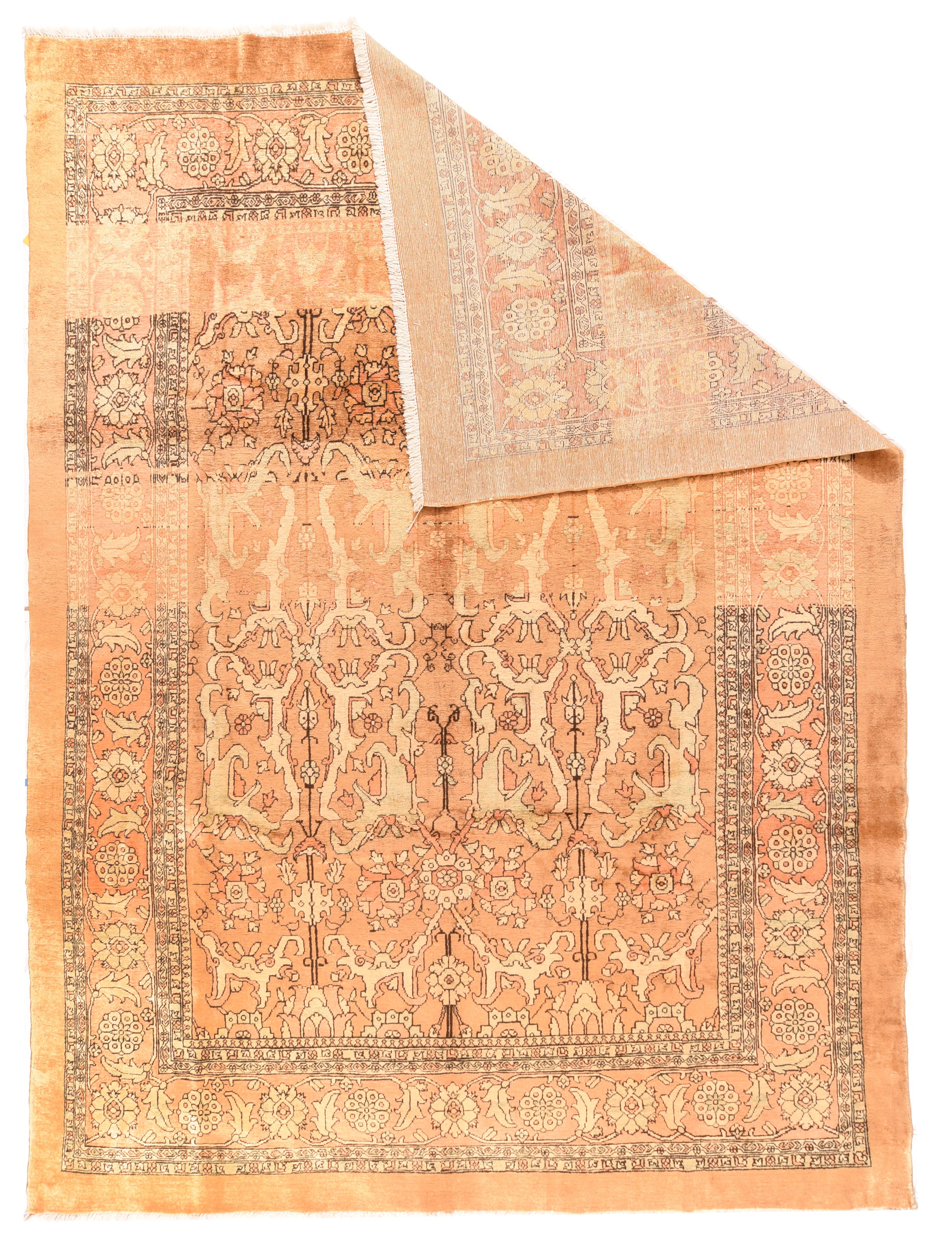 The golden camel field is clearly panel abrashed and displays a three column allover palmette pattern Camel tan rosette and barbed lancet leaf border and a plain camel outermost strip. Moderate weave on cotton. Narrow palette with mellow general