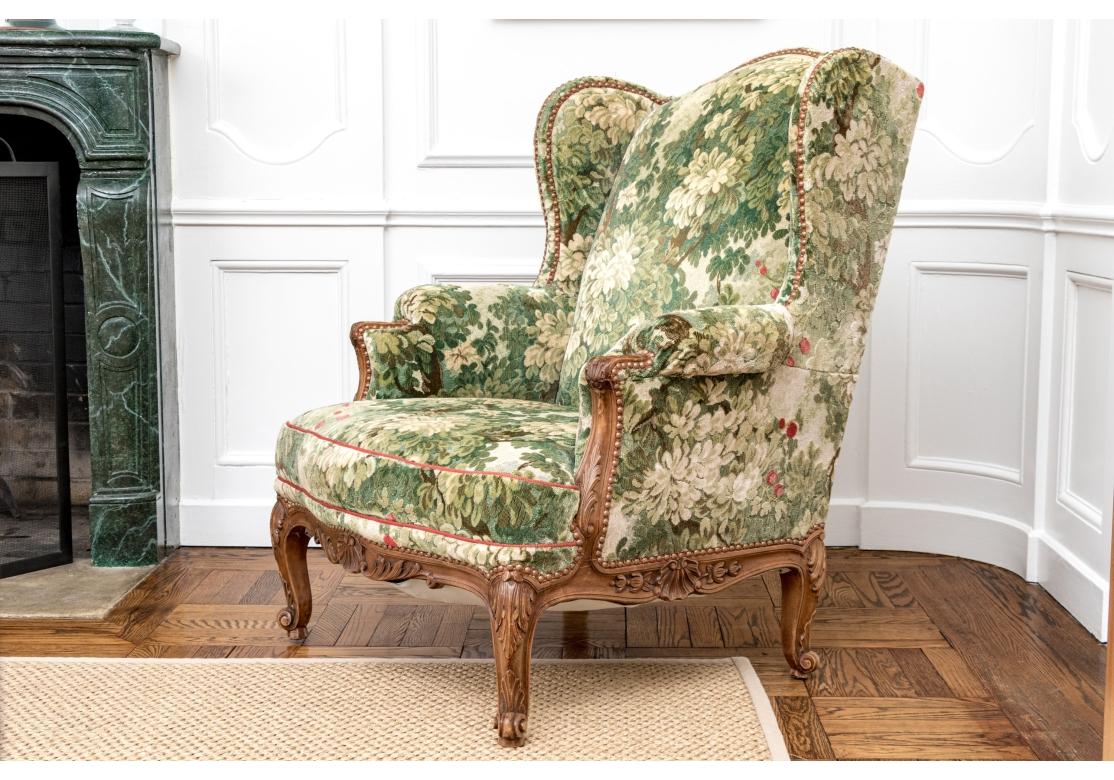 Semi Antique Custom Upholstered Carved Wing Chair For Sale 5