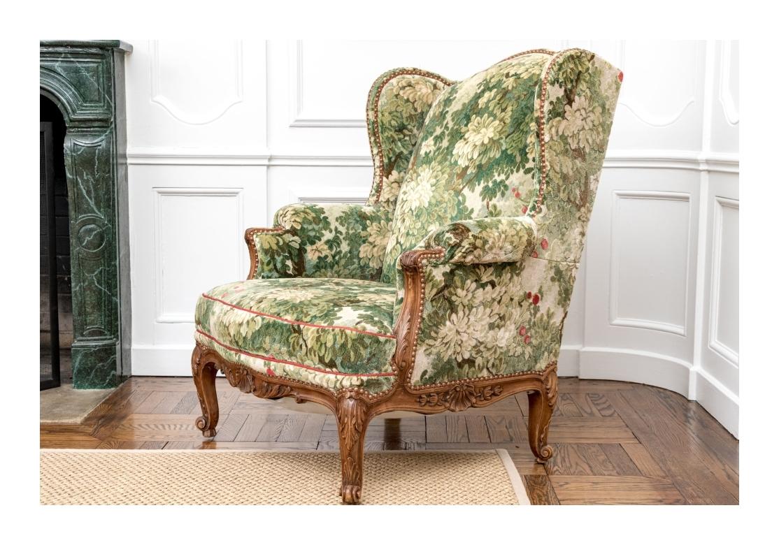 Semi Antique Custom Upholstered Carved Wing Chair For Sale 10