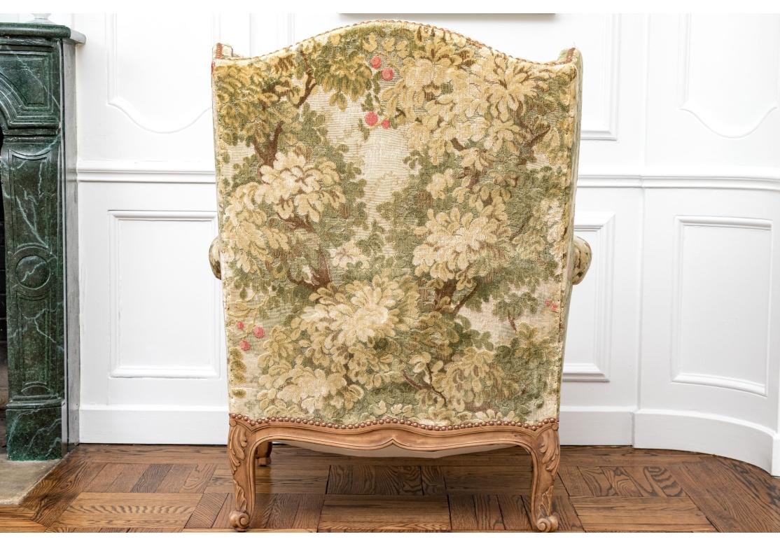 Brass Semi Antique Custom Upholstered Carved Wing Chair For Sale