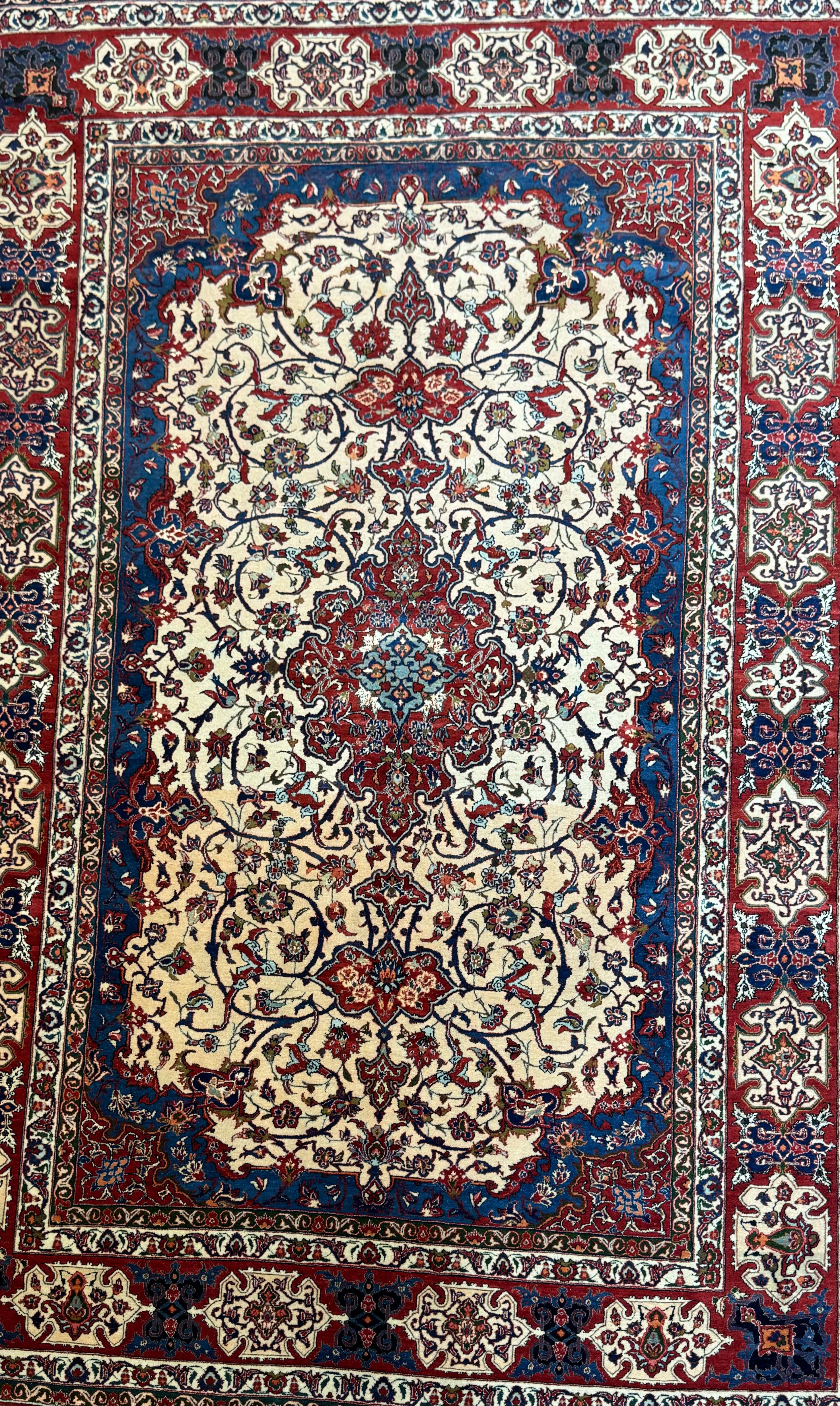 A Magnificent Semi Antique Persian Isfahan Rug that originates from Iran from the mid-20th century. This rug has beautiful color combinations and is in excellent condition.
