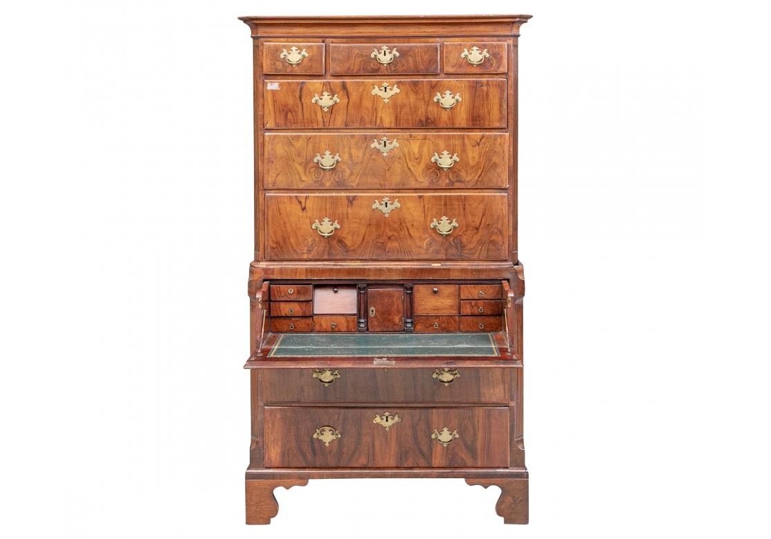 The classic lines with a cornice on top and canted corners with ribbed supports. The upper chest with three over three graduated dove-tail constructed drawers. The middle and lower drawers with compartments. The lower case with a fall front