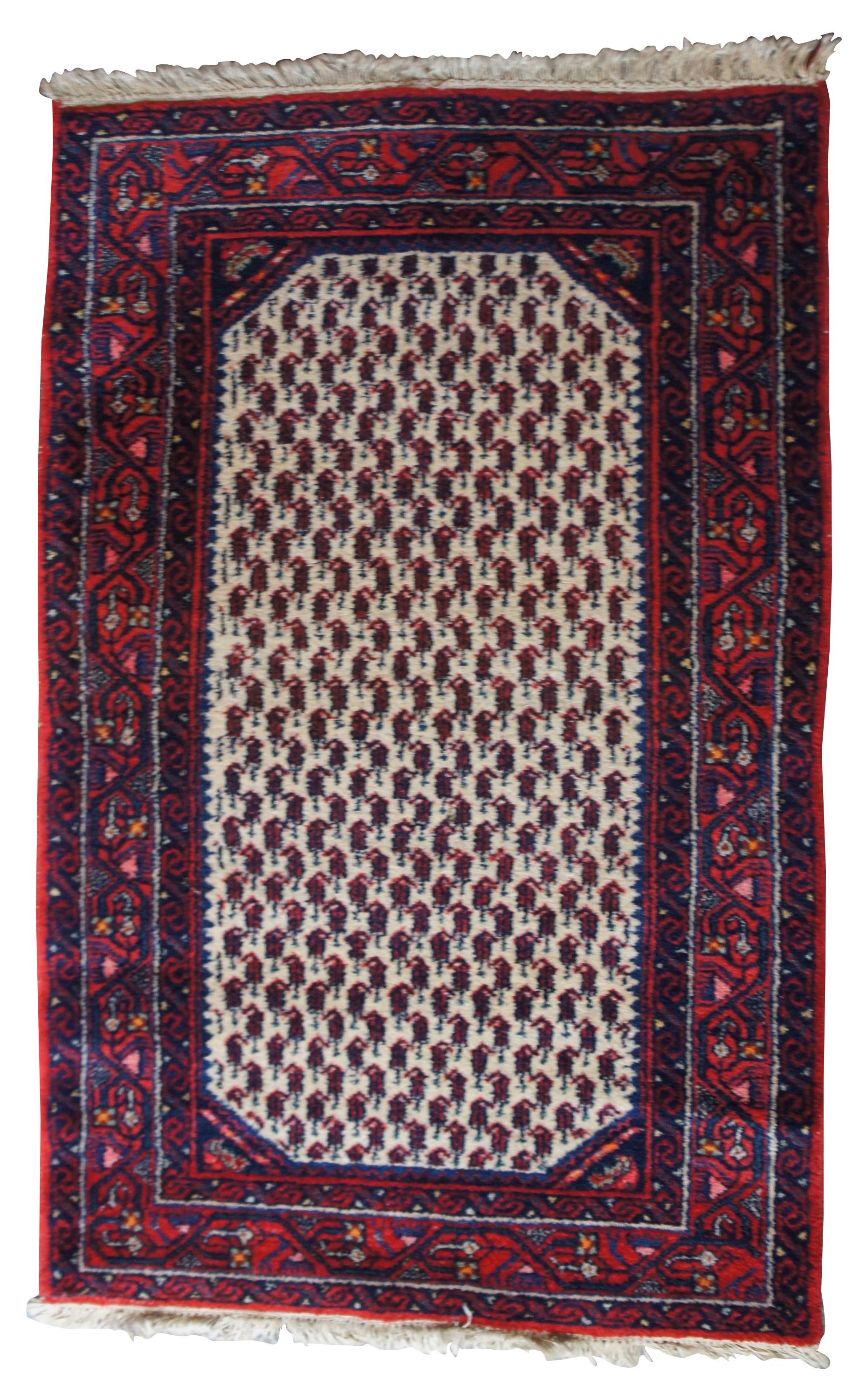 Ianian area rug features a field of red and blues with a cream center. Measures: 3' x 4'.
 