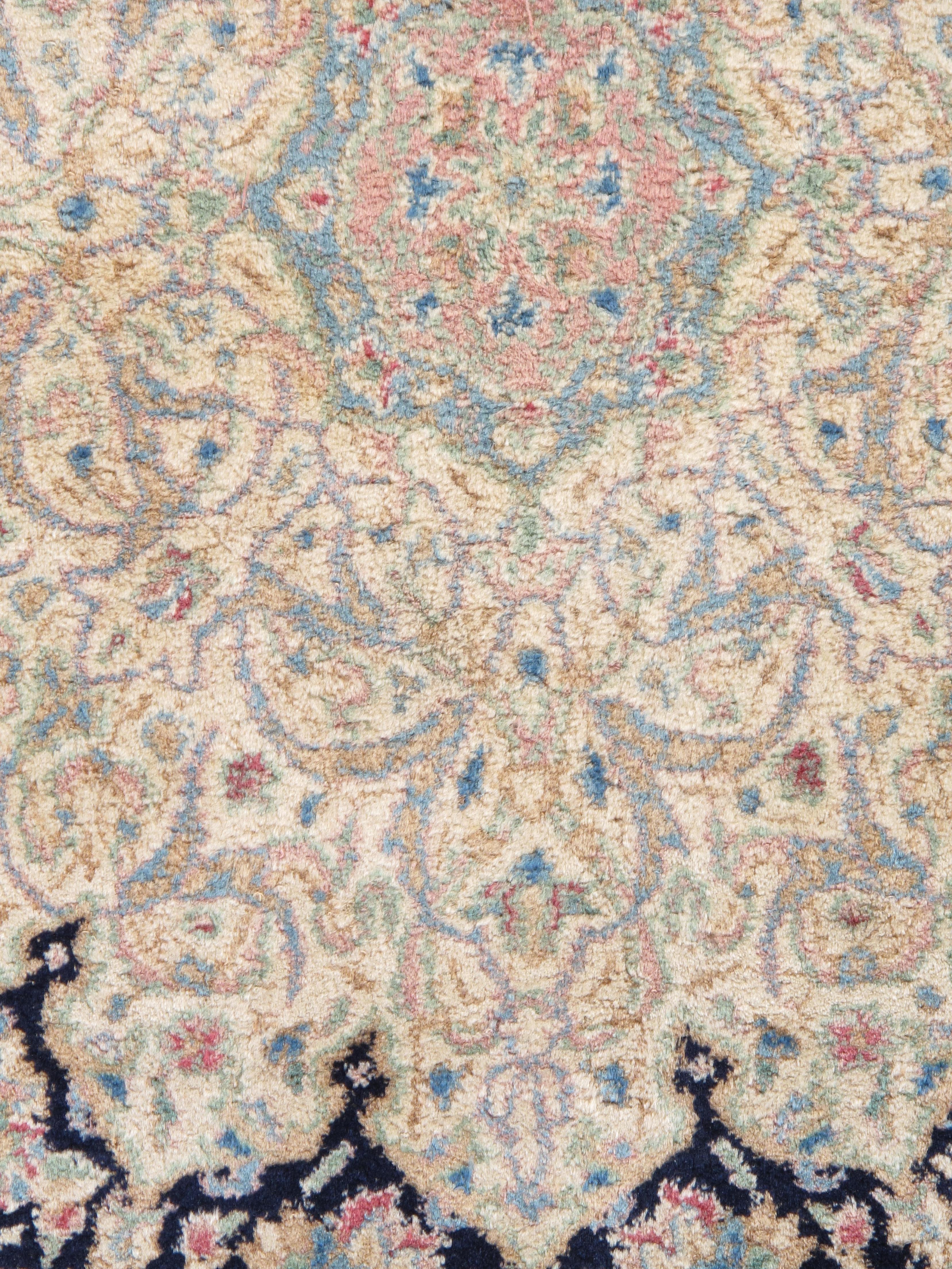 The 1950s Persian Kerman carpet, particularly in the Sheikh Safi design, is a stunning example of traditional craftsmanship that beautifully blends artistry and history. This specific design is renowned for its intricate patterns and rich symbolism,