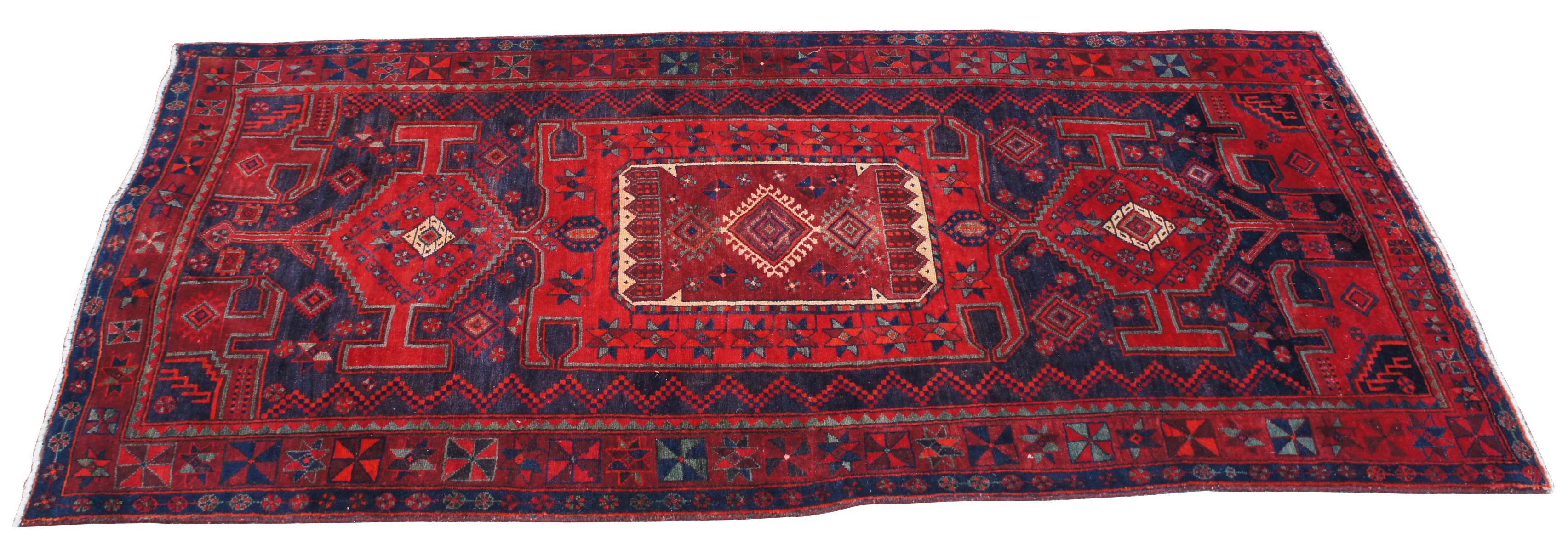 Touserkan rugs are handwoven by Persian and Kurdish nomadic tribes in Northeastern Iran Bordered, Persian. A beautiful example full of vibrant blues and reds in a traditional graceful design. Measure: 9'.