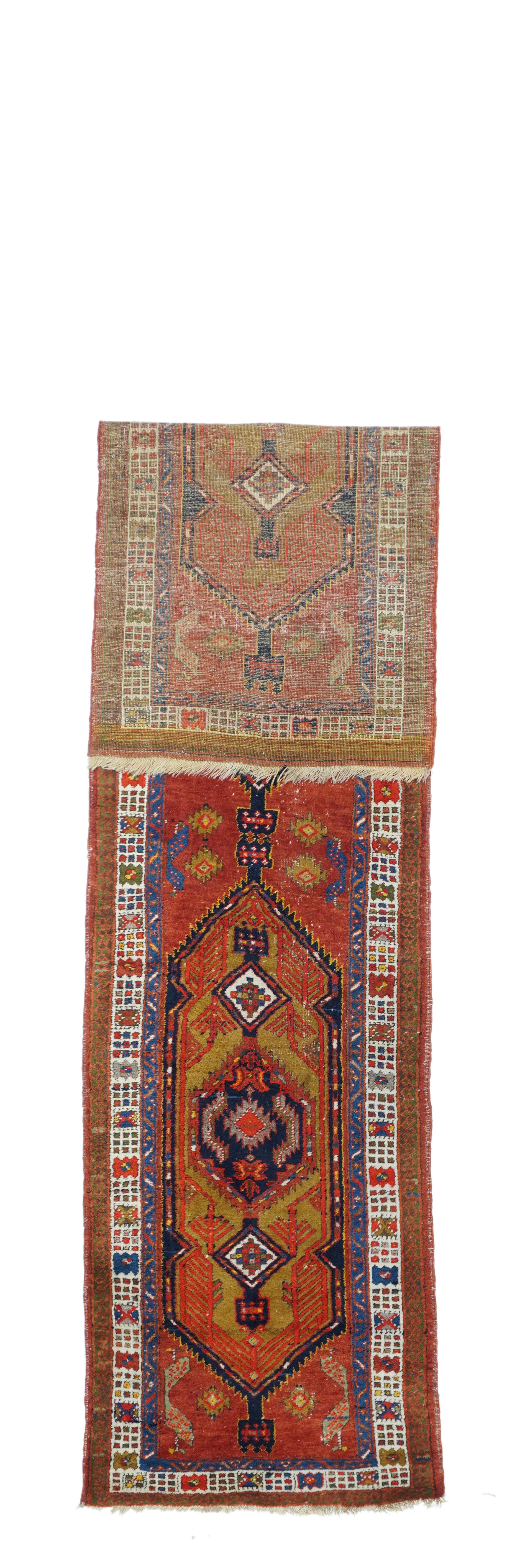 The NW Persian town of Sarab is at one corner lof the Heriz District, and usually weaves all wool runners, but here is a classic camel-hair tone piece on cotton. The field shows two complete characteristic tall hexagons with pendanted conforming