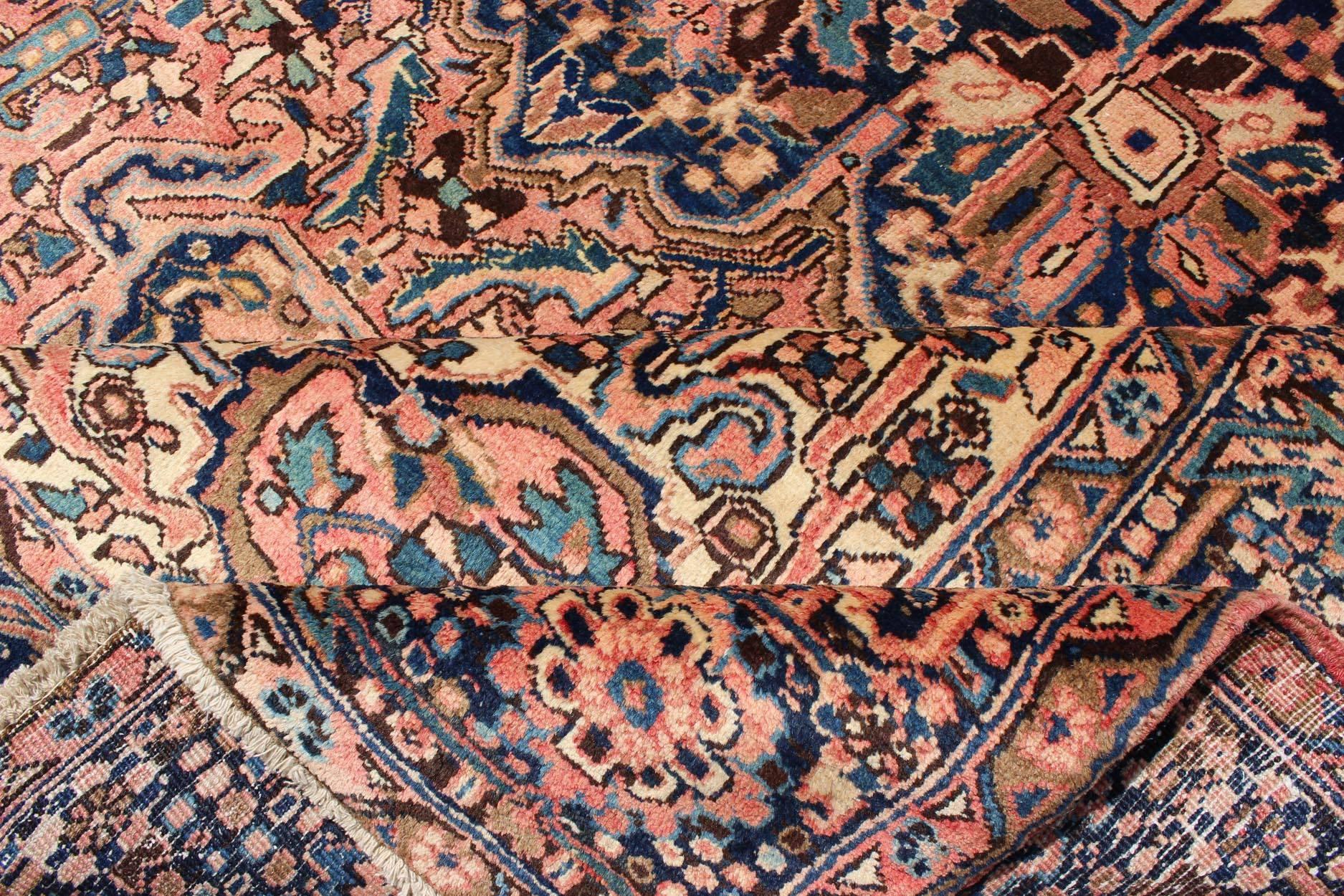 Semi Antique Persian Heriz Rug with Geometric Medallion in Salmon and Royal Blue In Good Condition In Atlanta, GA
