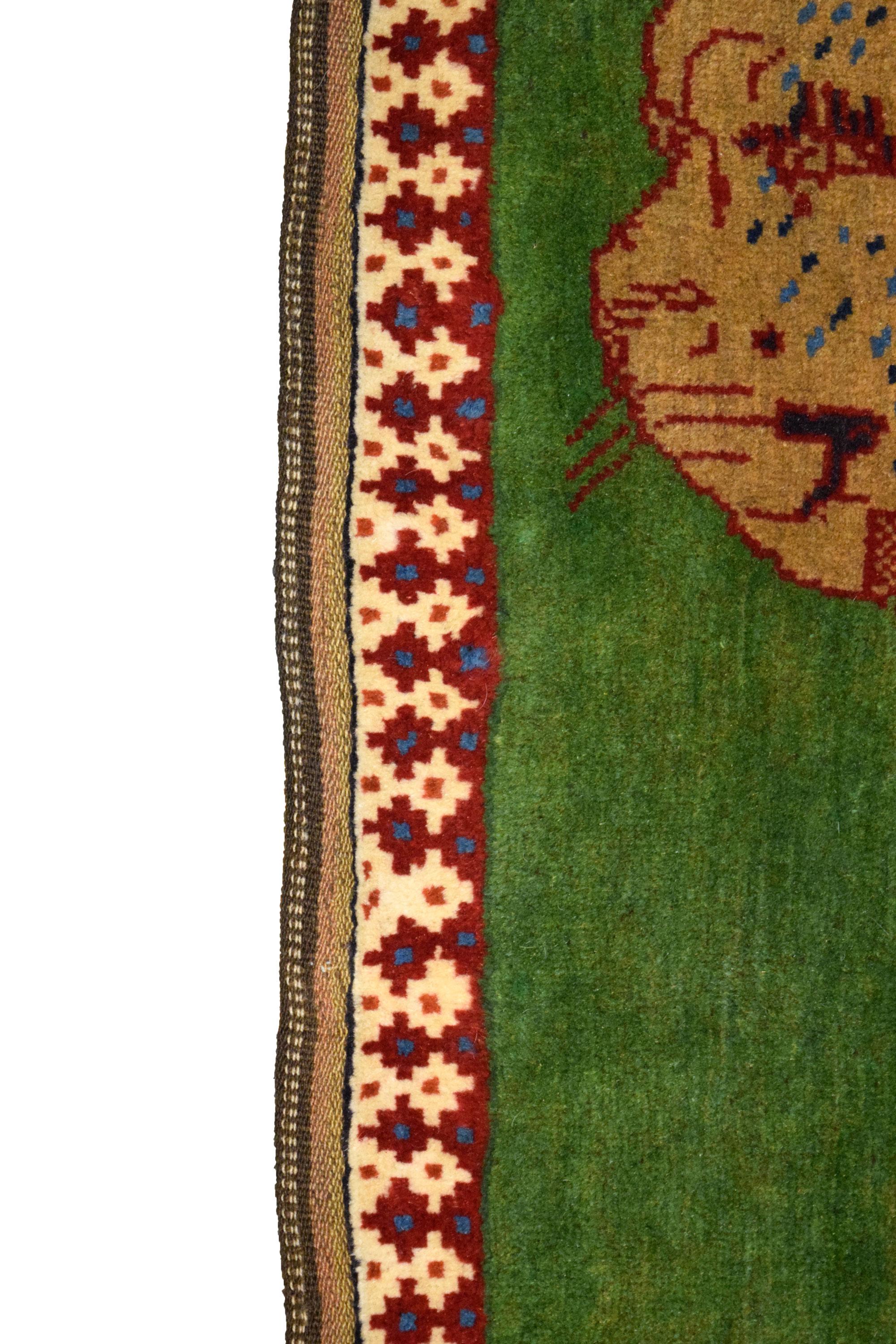 In vibrant shades of green, brown, red and cream wool, this vintage Persian Yalameh carpet is hand-knotted and belongs to the Orley Shabahang World Market Collection. Composed of pure handspun wool, this eye-catching carpet measures 3’4” x 4’9”, and