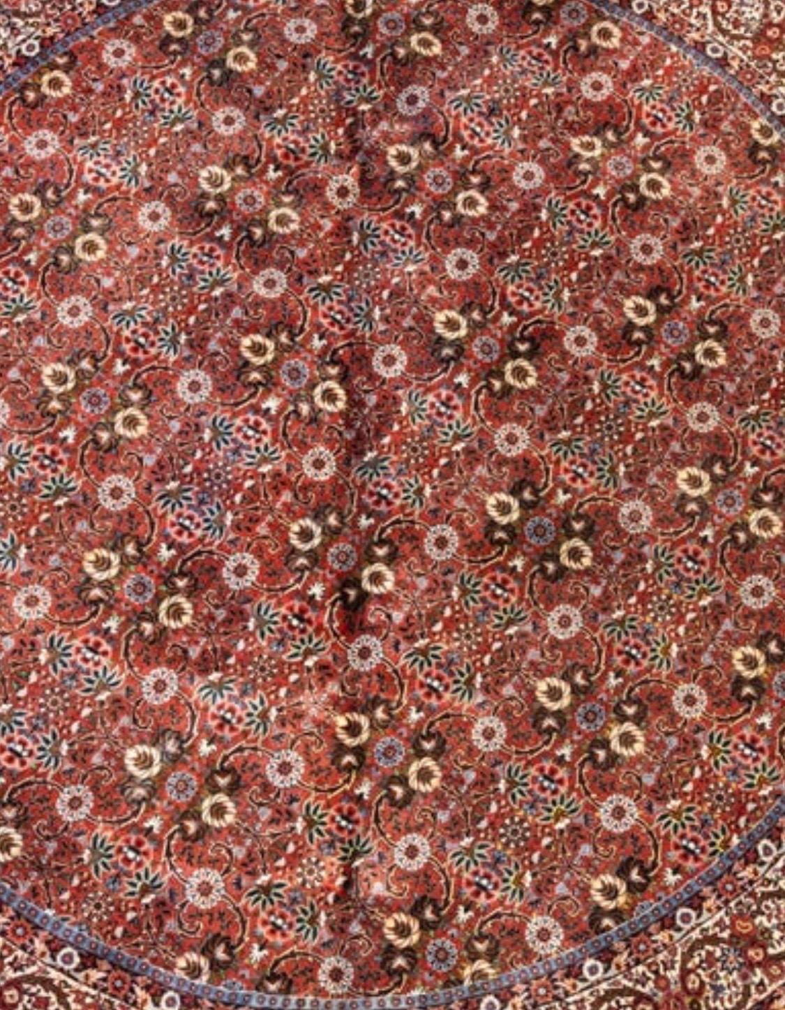 This is a lovely antique round Persian Bijar rug hand knotted in Iran in the 1980s and measures 9.10 ft. in diameter.

Bijar rugs are mainly woven in the town of Bijar and its surrounding villages. Bijar is located in the province of Kurdistan in