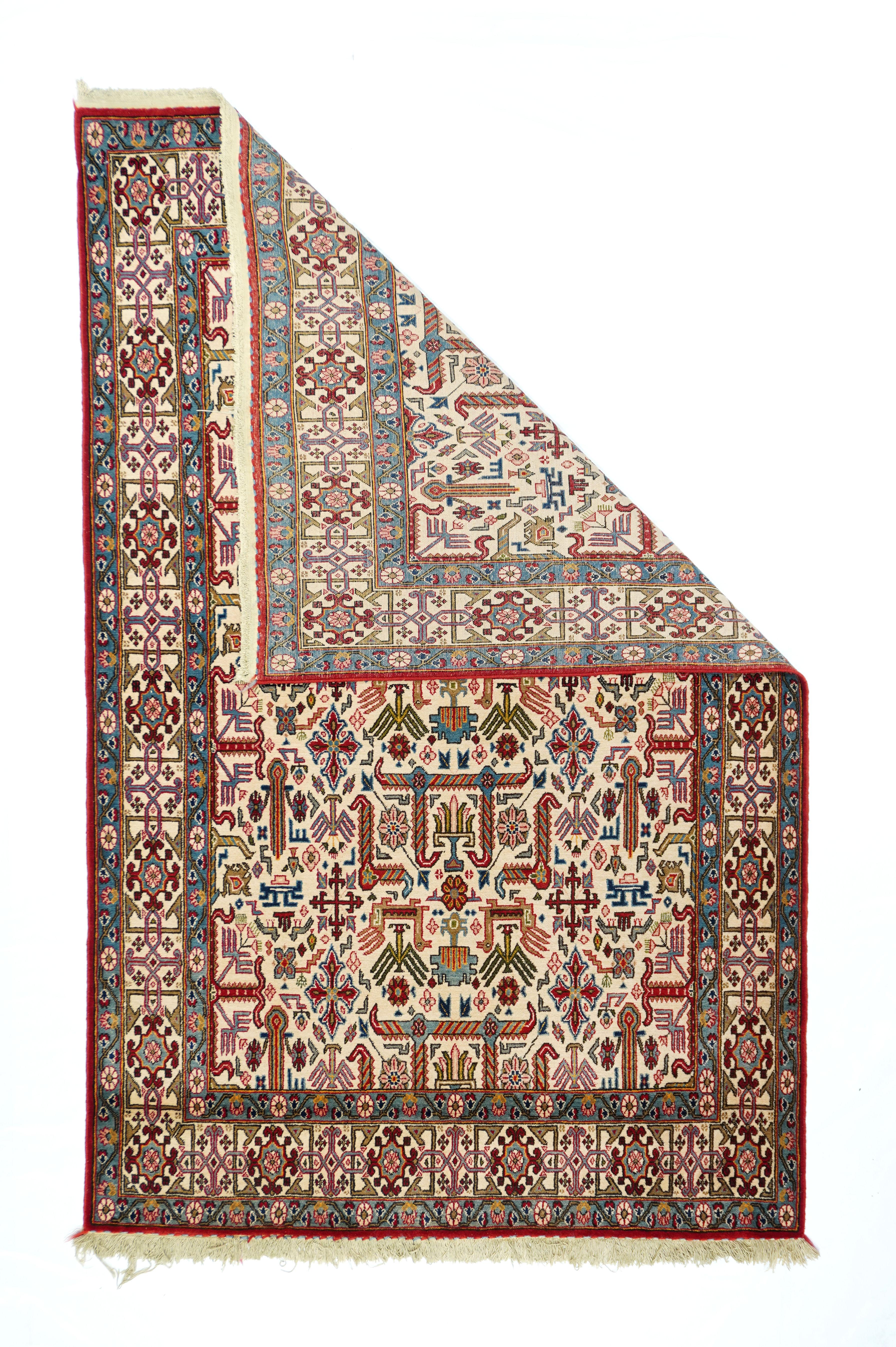 This post-WWII central Persian scatter has a neo-Caucasian design on an ecru field of right-angle “goosenecks” and small birds (probably peacocks or roosters), set within an ivory ground “Kufesque” border. Symmetric knots, excellent quality short