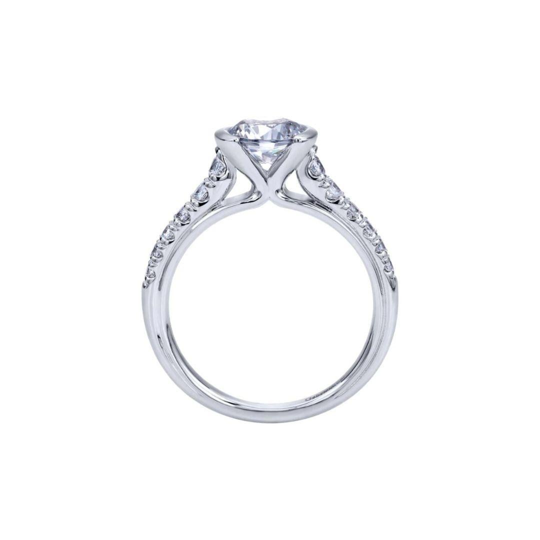Ladies' 14k White Gold Diamond Engagement Mounting. Mounting features a semi bezel head and beautiful pave work on the shank of the ring. Center diamond NOT included. Total carat weight of diamonds 0.38 ctw, H color, SI clarity.